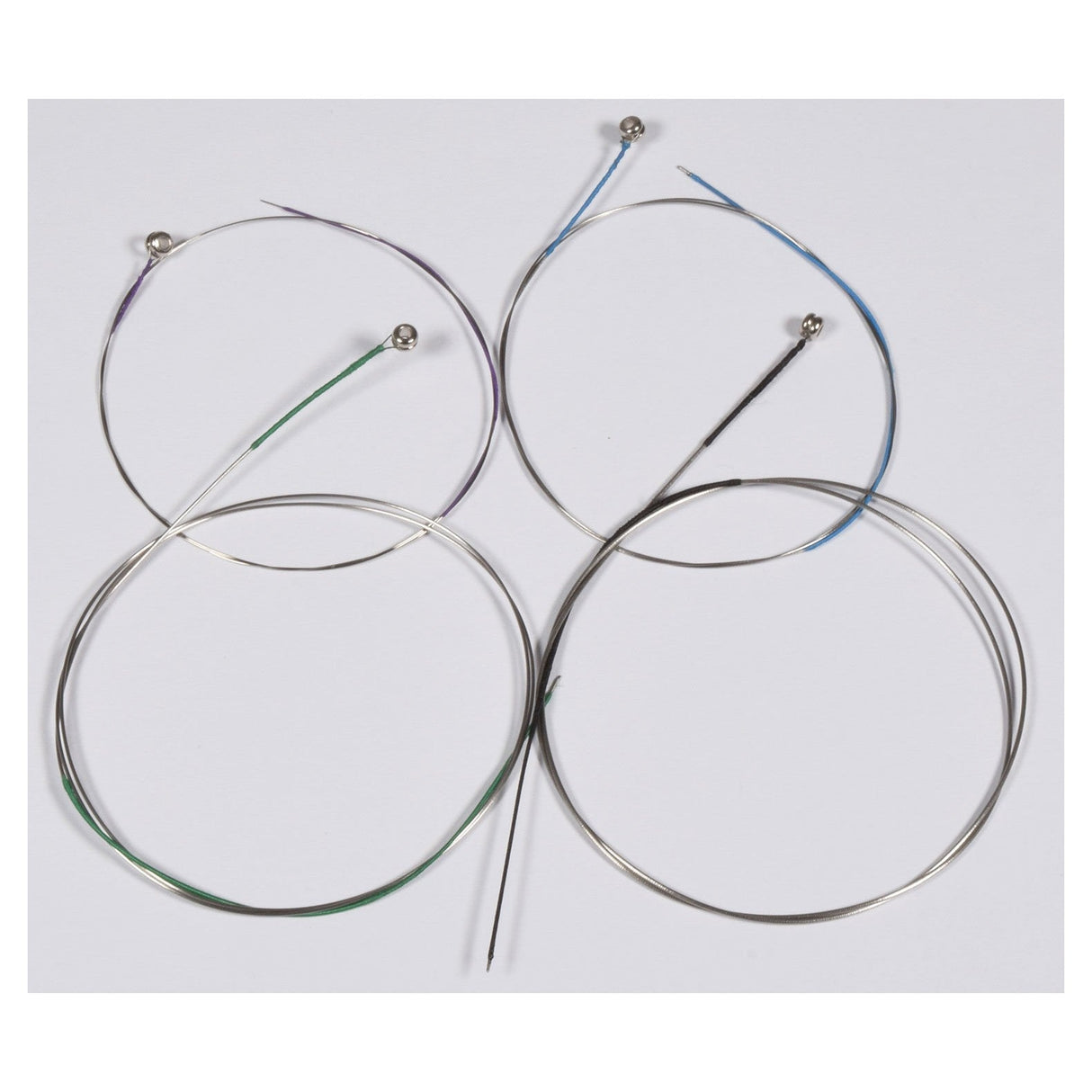 Four Chord Violin Strings from the 10-30 set are laid out on a flat surface, featuring Nickel-Chromium windings. Each string ends with a colored ball, showcasing vibrant hues such as blue and green. The strings differ in thickness and create a loose, overlapping pattern reminiscent of guitar string arrangements.