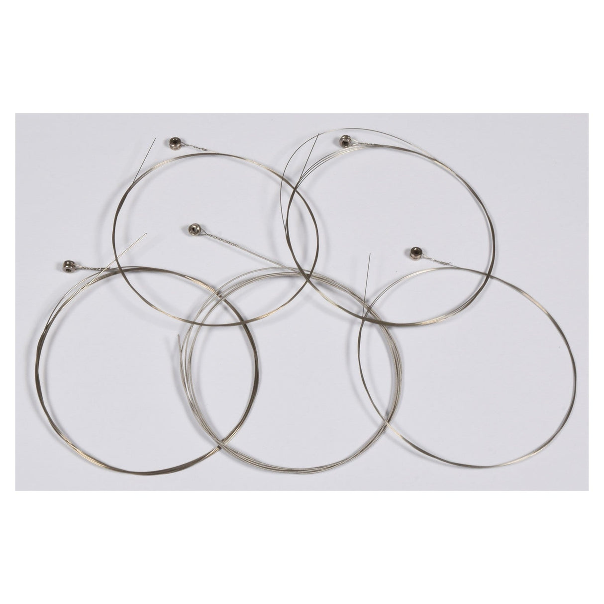 The Chord G-Banjo 5-String Set features five expertly coiled steel strings with ball ends, elegantly layered on a plain white background. These strings exude quality and precision, making them perfect for enhancing the sound of your G-banjo or acoustic guitar.
