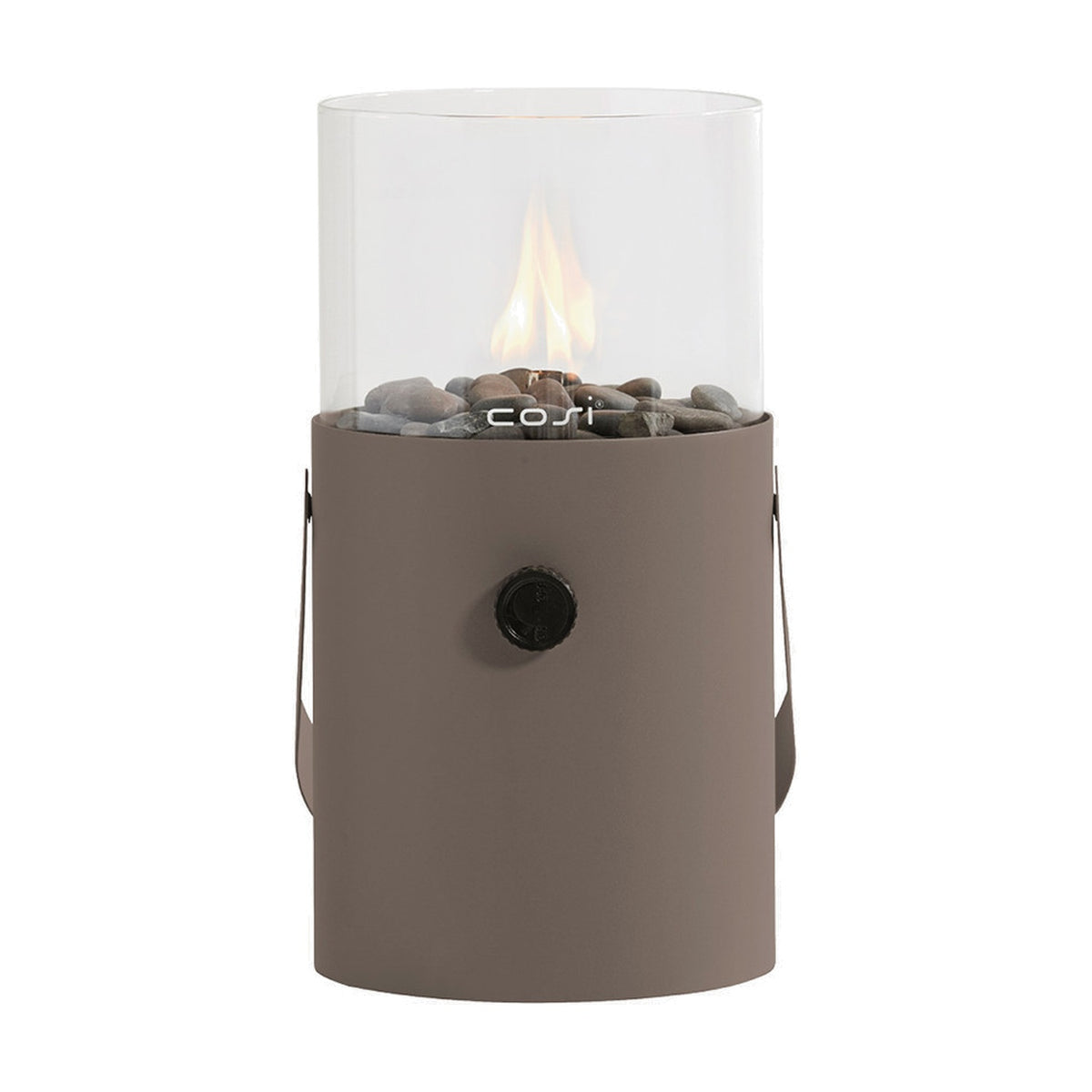 Cosi Clay Gas Flame Lantern, 30cm cylindrical steel base in clay finish with clear glass tube, lit flame over pebbles, control knob and side handles, on a plain white background.