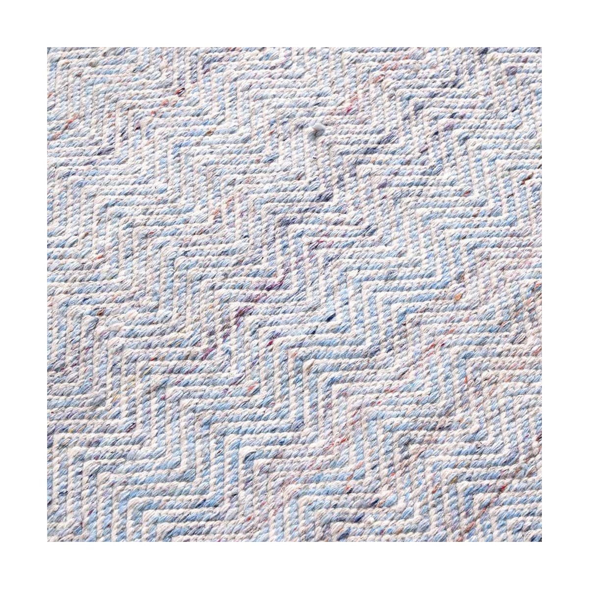Close-up of an Indoor Outdoor Inca Design Rug, 230 x 160cm, showing a zigzag chevron weave in aqua blue and white polyester fabric.