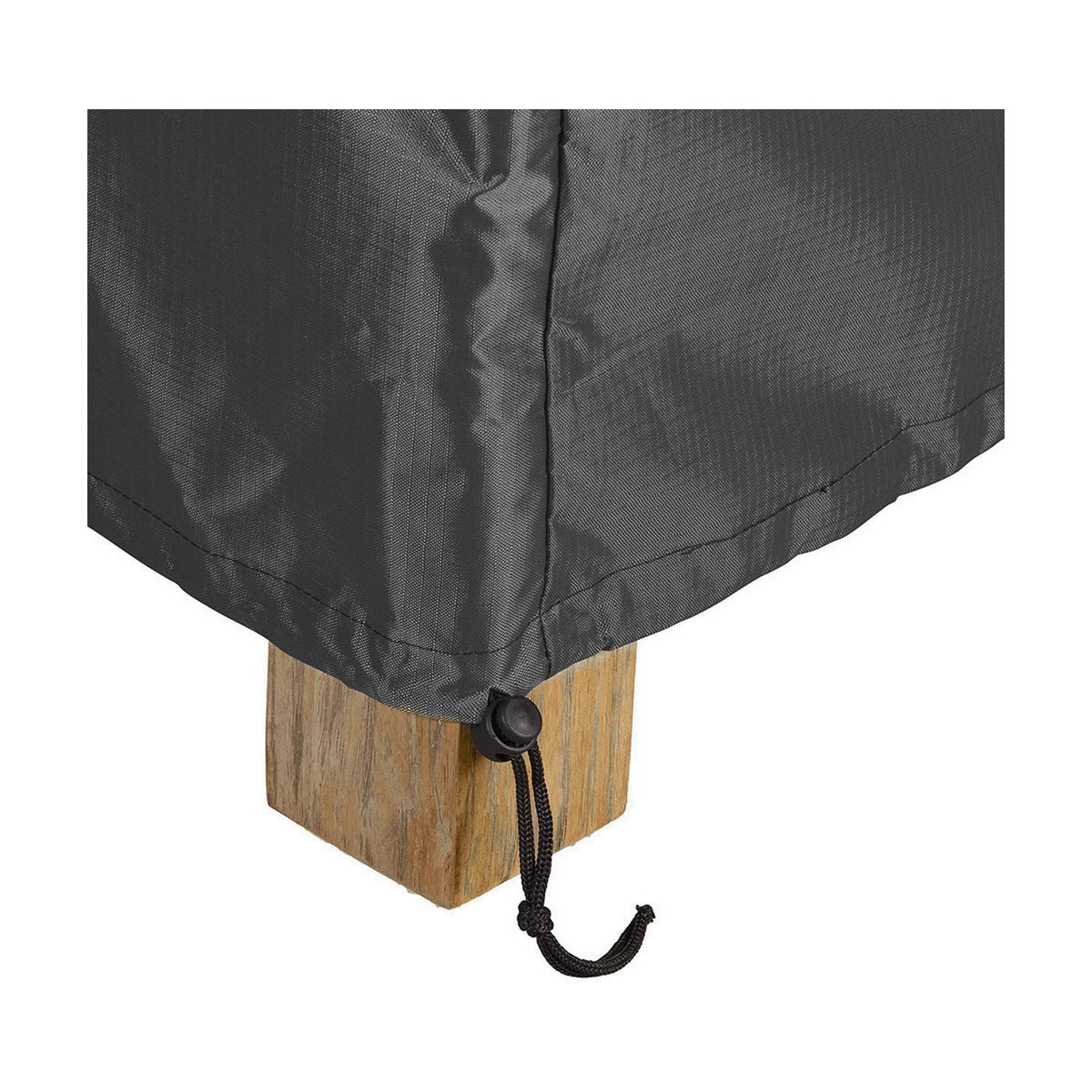 Close-up of the anthracite fabric Aerocover draping over a wooden furniture leg, showing a stitched seam and an elasticated corner with a black drawstring toggle.