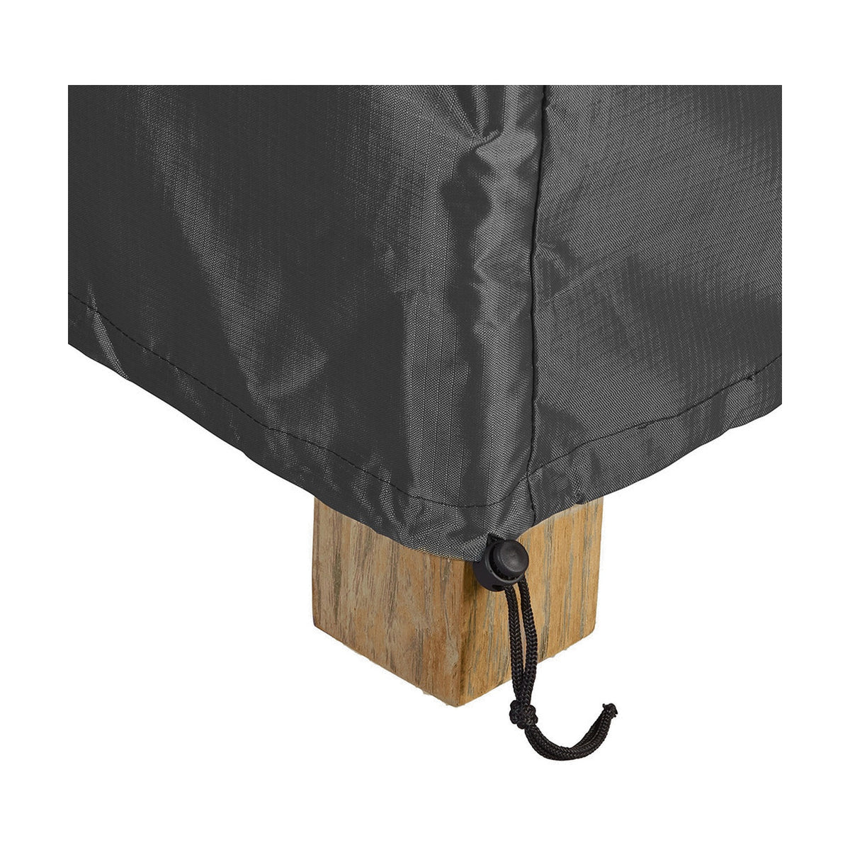 Close-up of the anthracite fabric Sunbed Aerocover (210 x 90cm) draped over a wooden furniture leg, showing the stitched seam and black drawstring toggle.