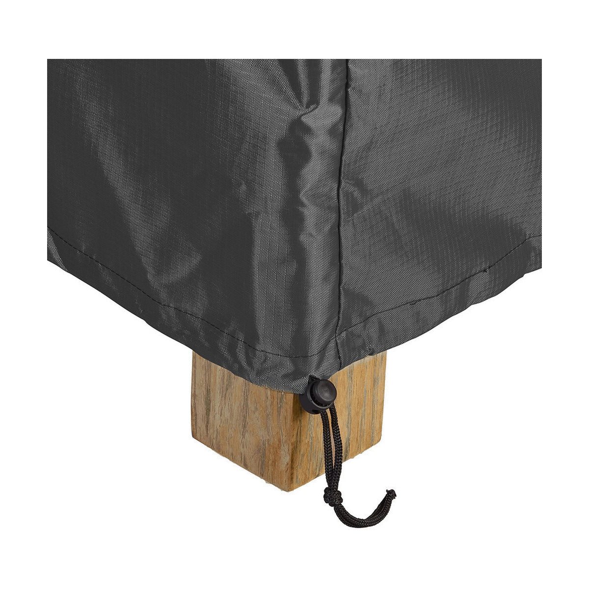 Close-up of the Firetable Aerocover, 110 x 84cm, in anthracite fabric with a corner drawstring toggle cinched around a wooden table leg on a plain white background.