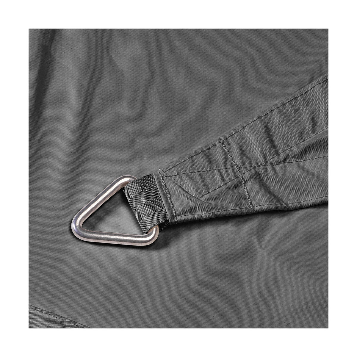 Close-up of the Square Shade Sail in grey, showing a reinforced corner with stitched fabric strap and triangular metal fitting ring.