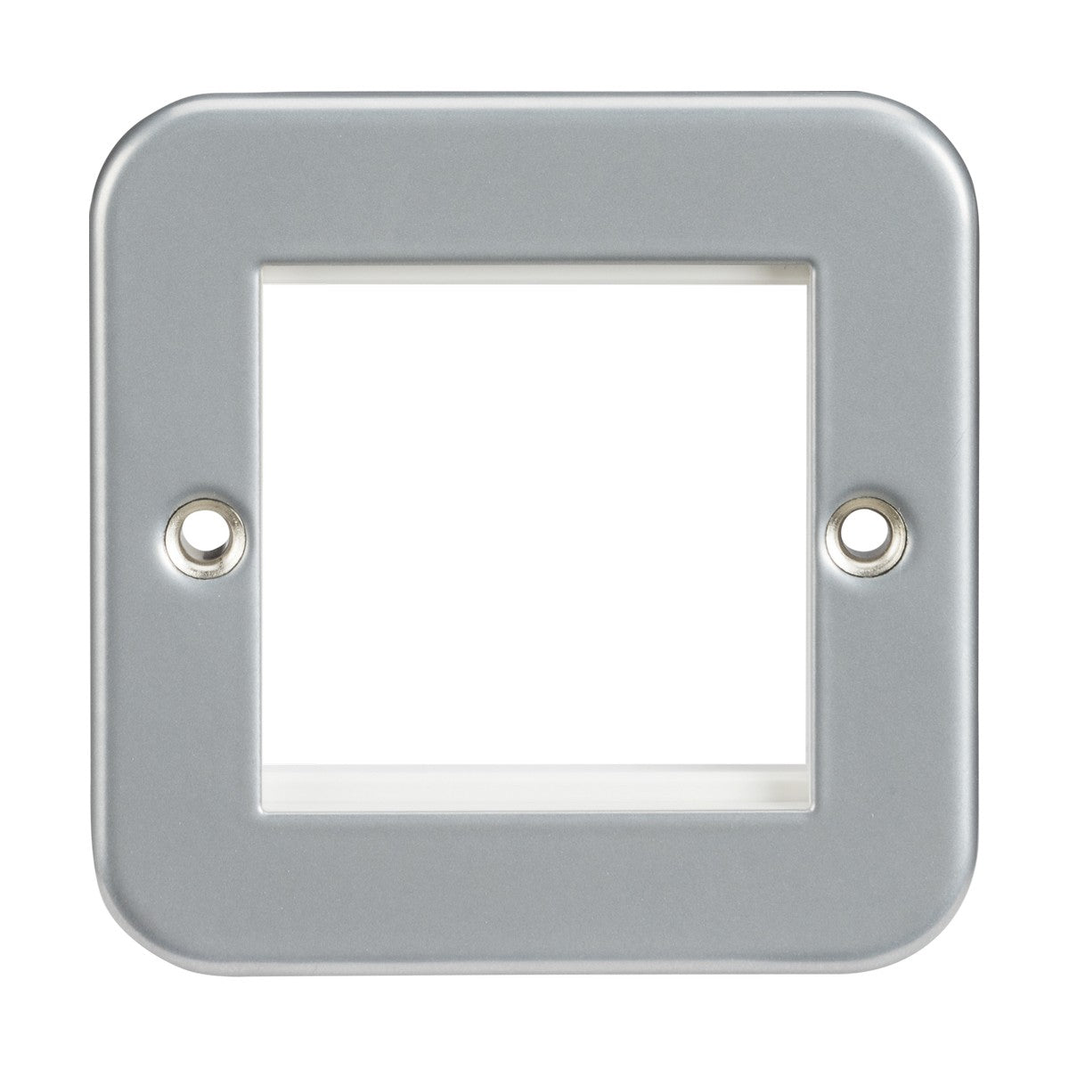 The Metal Clad 2 Gang Modular Faceplate is a metallic, square euro-module frame with rounded edges and two circular holes on opposite sides. The center allows visibility through to the background, and the frame is gray with a smooth finish, rated IP20.