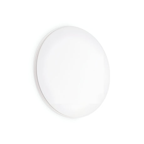 A minimalist, round white lighting fixture with a modern design, the NovaLite LED Round Ceiling & Wall Light 11W 3000K subtly enhances the simplicity of its surroundings with its clean lines and absence of visible elements against a plain background.