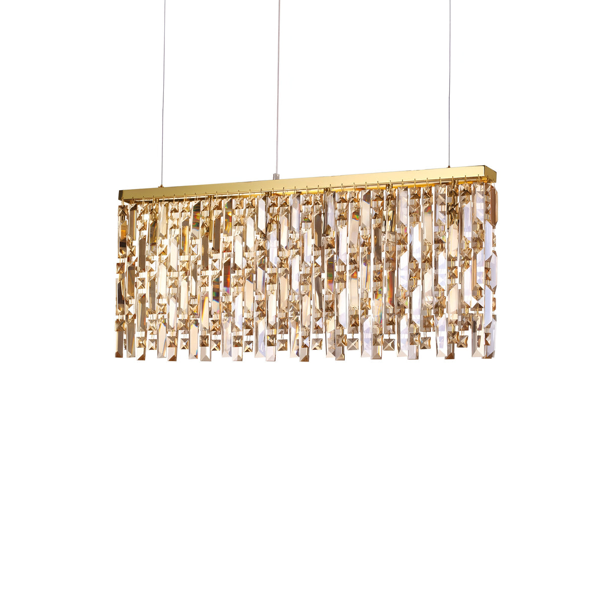 The Glister 6 Linear Suspension Light - Brass, 80cm features a rectangular design with a gold frame and amber cut crystal prisms, creating a warm, elegant glow. This lighting fixture is suspended by two thin wires and adds a touch of luxury to any space.