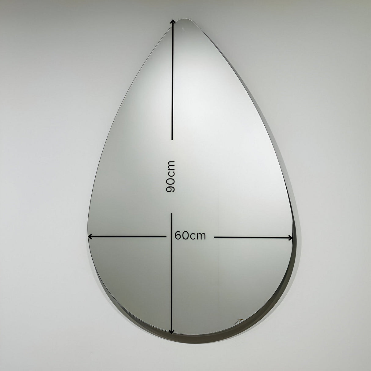 The Oculus Droplet Wall Mirror Clear - 90x60cm features a unique teardrop shape, measuring 90 cm tall and 60 cm wide, perfect for adding style to any plain wall.