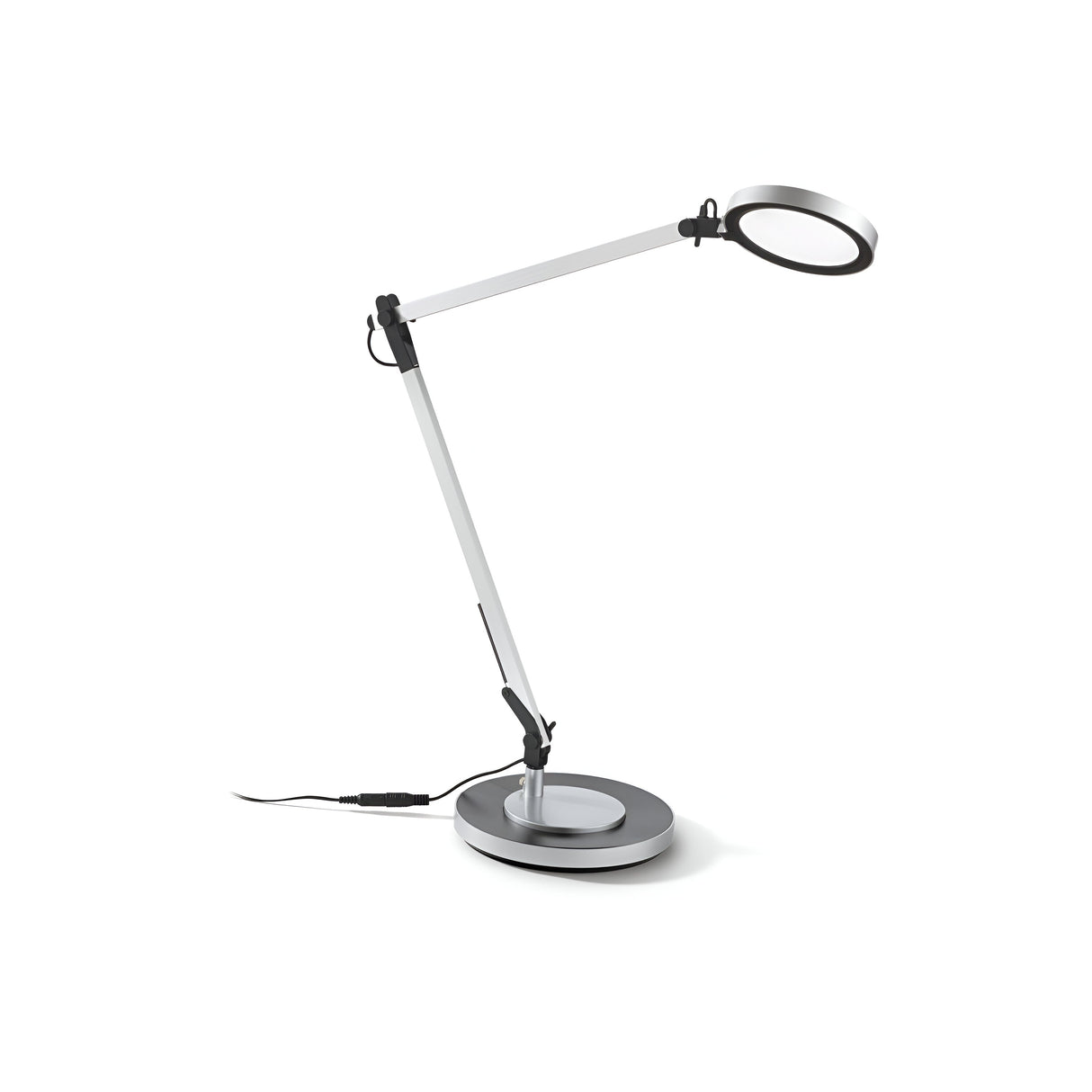 Introducing the Prismora LED Table Lamp 12.5W 4000K - Silver, a sleek addition to contemporary interiors. Featuring an adjustable arm and innovative LED diffuser, this lamp brilliantly illuminates your space. Its silver finish and circular base enhance elegance against a plain white background.