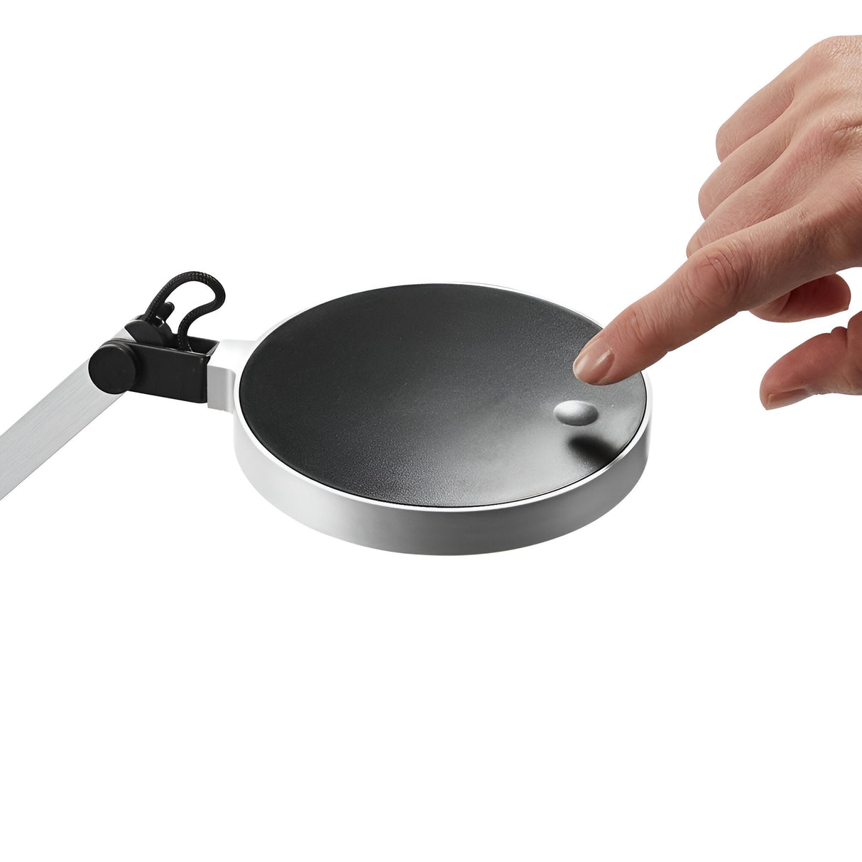 A hand touches a sleek, silver Prismora LED Table Lamp, characterized by its modern design and round black base, with an adjustable arm. The background is white.