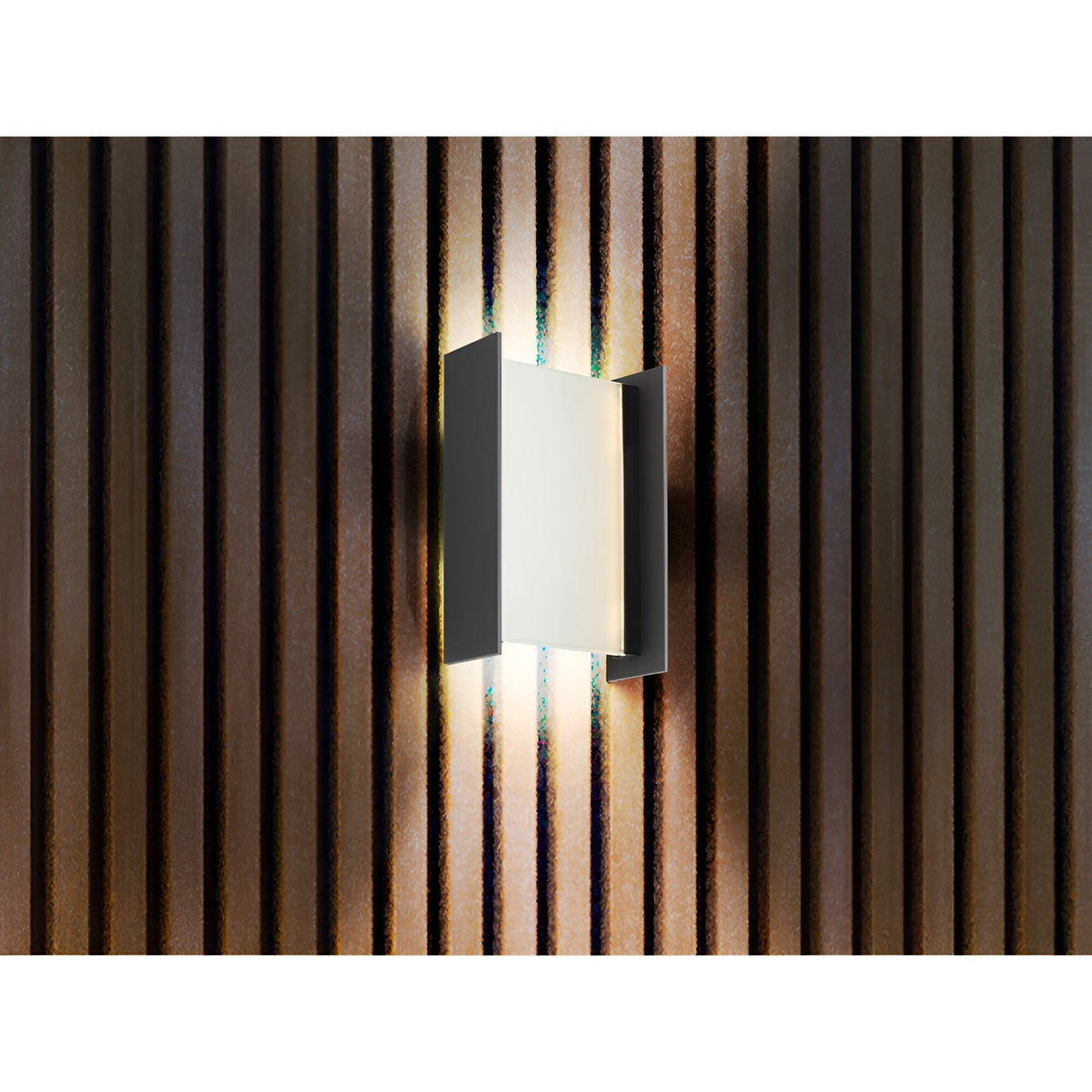 The Matia Outdoor LED Wall Light 18W 3000K in Dark Grey features a modern rectangular design and emits soft, warm light between slats, creating a stylish ambiance—ideal for sophisticated outdoor spaces.