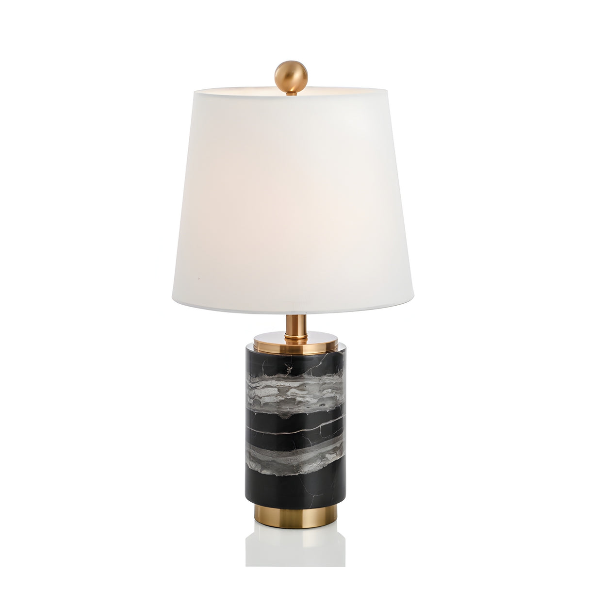 The Valmera 1 Light Cylinder Marble Table Lamp features a white tapered shade, brass accents, and a cylindrical black marble base with white and gray veining.