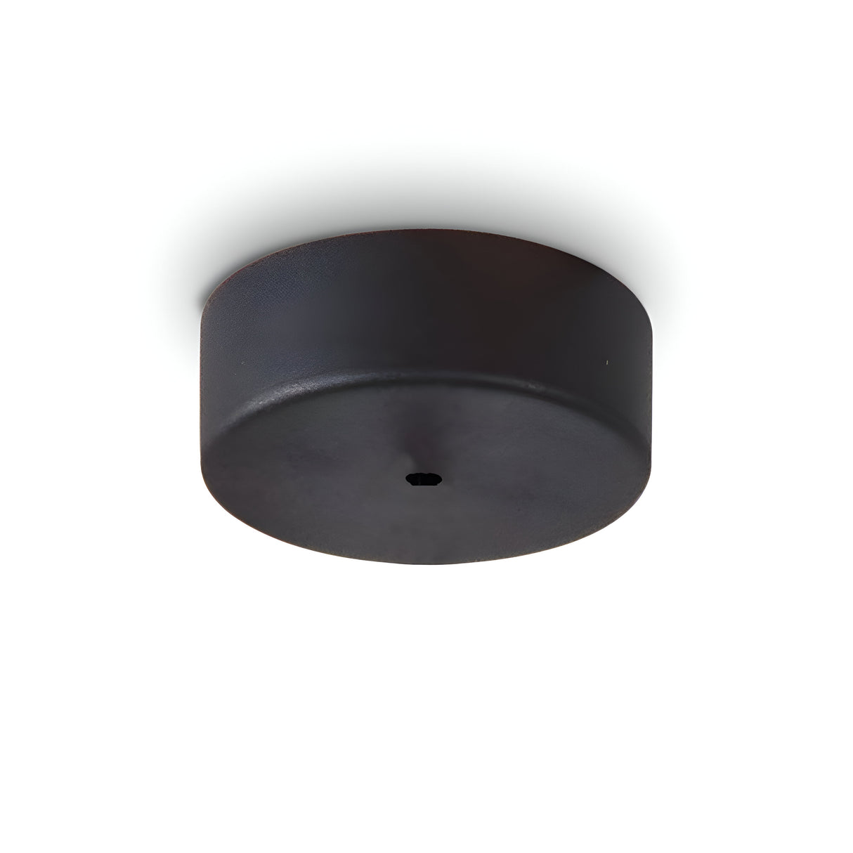 A black, cylindrical Glacia-1 1 Light Magnetic Ceiling Rose, with a smooth finish and a small circular center indentation akin to dynamic lighting setups, is photographed against a white background.