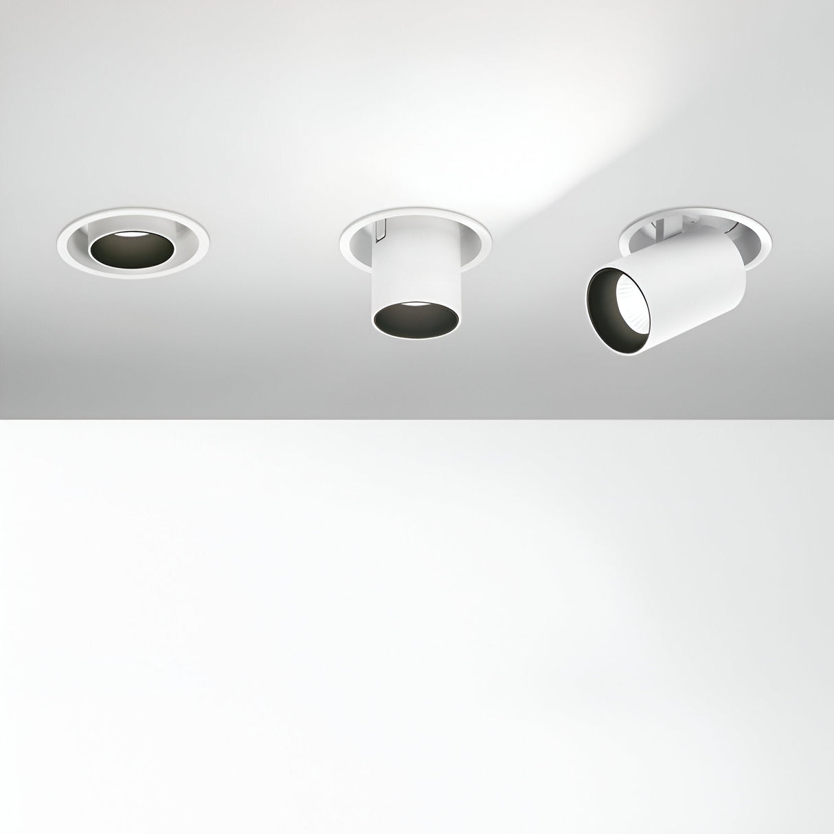 Three ceiling-mounted spotlights are displayed: the Solis LED Single Recessed Spotlight 12W 3000K in white, a cylindrical spotlight, and an adjustable spotlight. All feature a modern, minimalist design in white and provide soothing 3000K light.