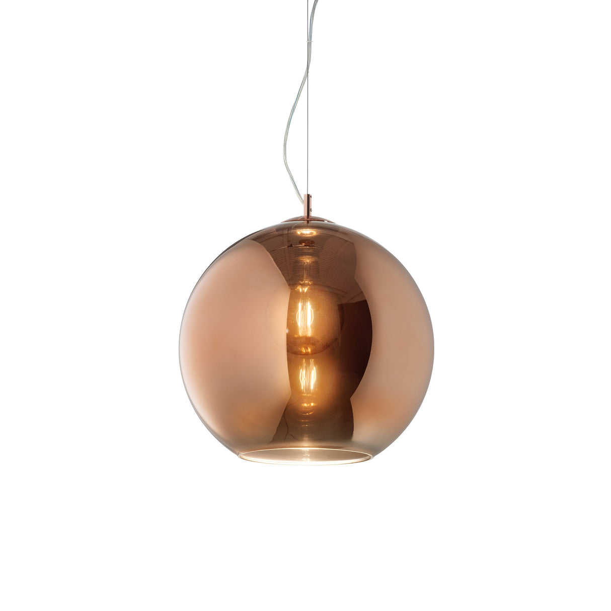 Hanging from the ceiling is a spherical pendant light with a copper hue and a glossy, reflective surface. The visible cord supports the pendant, while its dimmable interior bulb emits a warm glow that accentuates the metallic finish. This Emberlyte 1 Light Glass Pendant - Copper, 20cm elegantly enhances any room's decor.