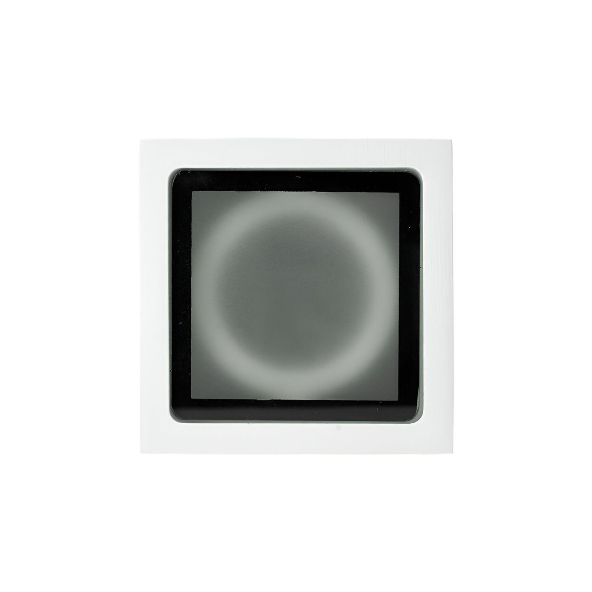 The Helixis Outdoor Small Downlight - White features a circular design, slightly blurred, set within a white square frame with a smaller black square at its center. Its plain white background heightens the modern exterior allure and indicates an IP54 rating level of durability.