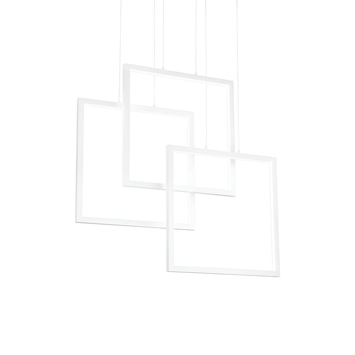 A set of three white square frames is elegantly suspended at varying angles against a minimalist white background, lit by the Prios Square LED Light Suspension 80W 3000K - White, forming a modern geometric lighting display.