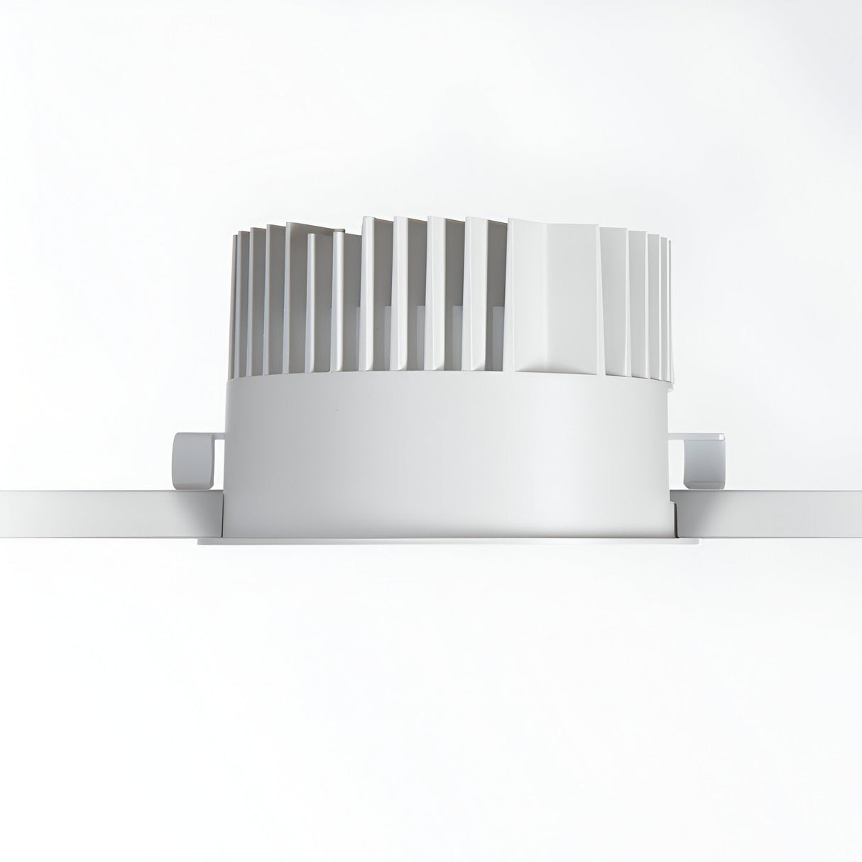 A white, cylindrical mechanical component with vertical fins on top, reminiscent of a Zeal Outdoor LED Recessed Downlight - 28W, 3000K, White, is mounted on a horizontal rail against a plain white background.