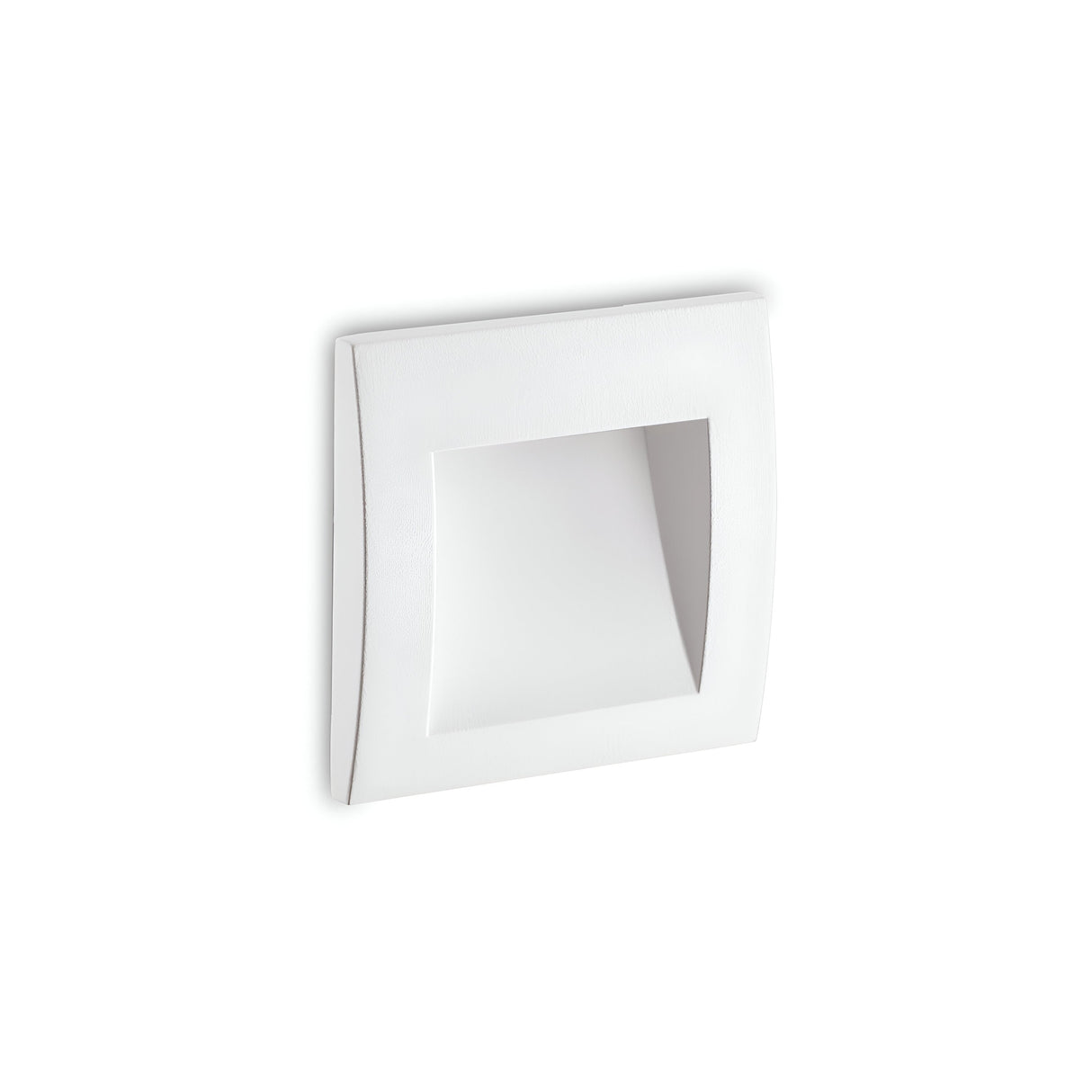 A Solyx Outdoor Recessed LED Wall Light 1.5W 3000K - White, 9cm is mounted on a plain white wall, showcasing its square-shaped design with a concave interior. The minimalistic aesthetic features clean lines and a subtle shadow effect, while offering an IP65 rating for reliable performance in diverse weather conditions.