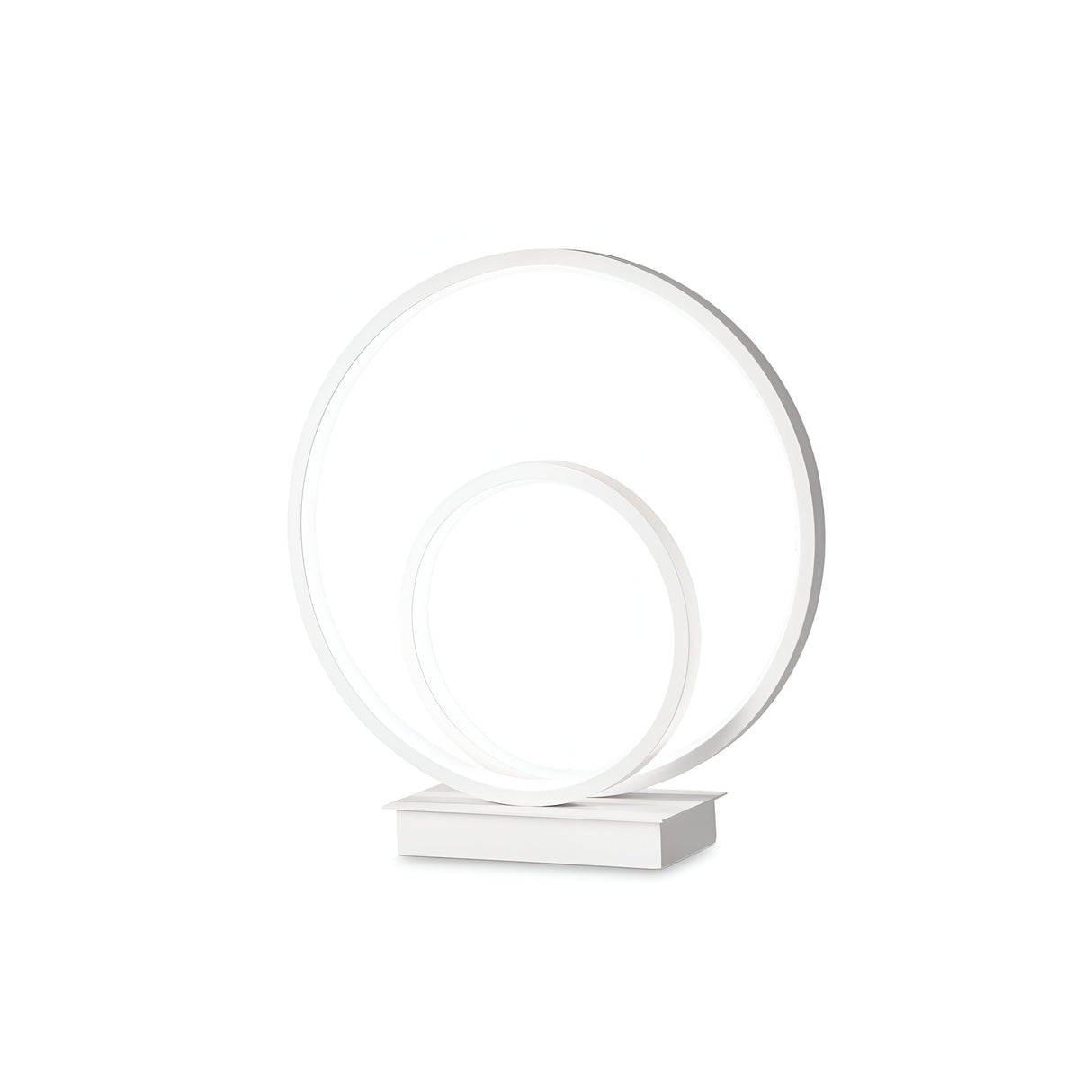 Introducing the Glistis LED Table Lamp 3000K, 23W in White: a sleek and contemporary table lamp with two interlocking white circular rings mounted on a rectangular base. This elegant design is ideal for complementing minimalist spaces and modern interiors.