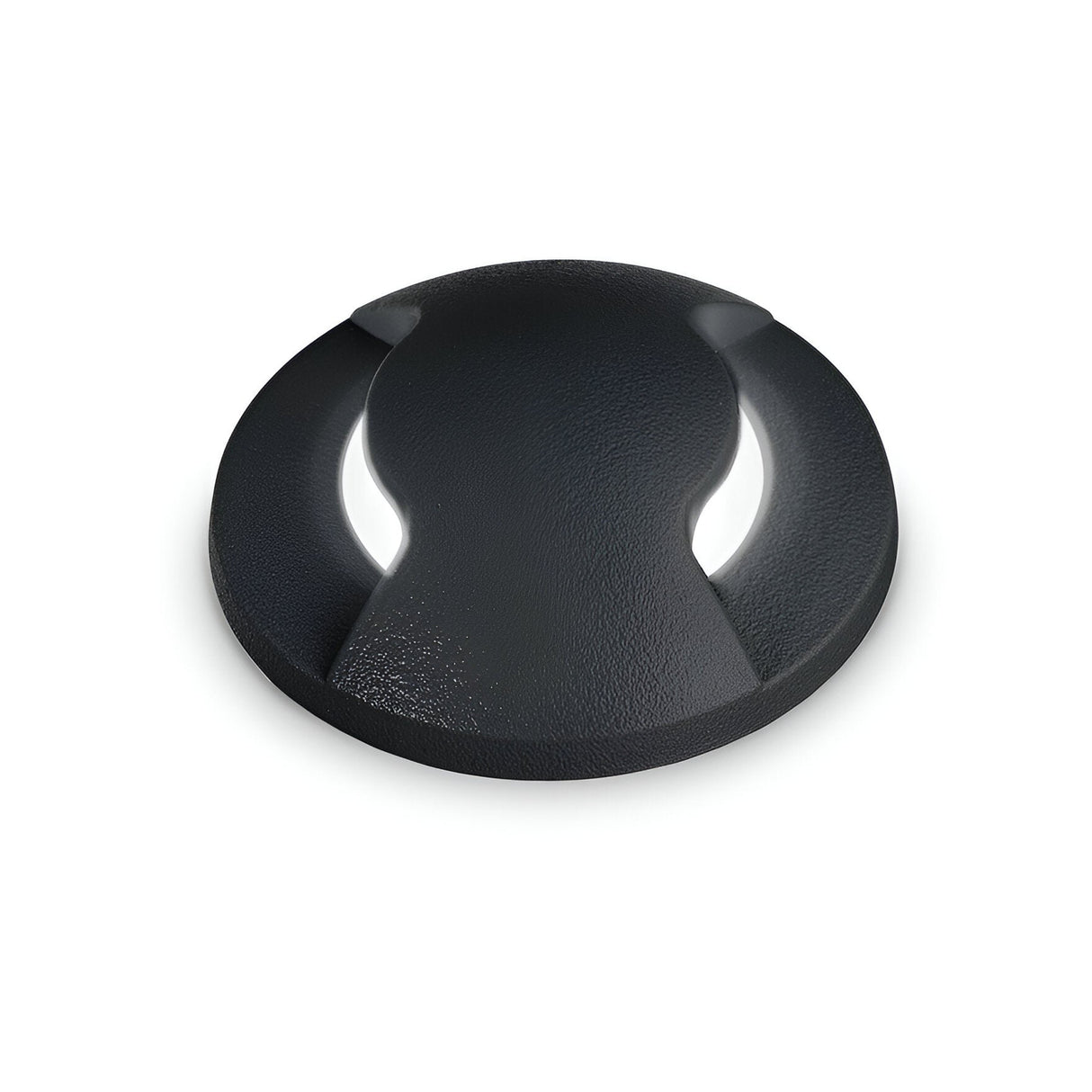 Introducing the Solarium Outdoor Drive Over Recessed Light Two-Sided 3000K in Black: a round, textured light made from high-performance resin, featuring a sleek, modern design with two symmetrical cutouts on the sides. Ideal for outdoor environments.