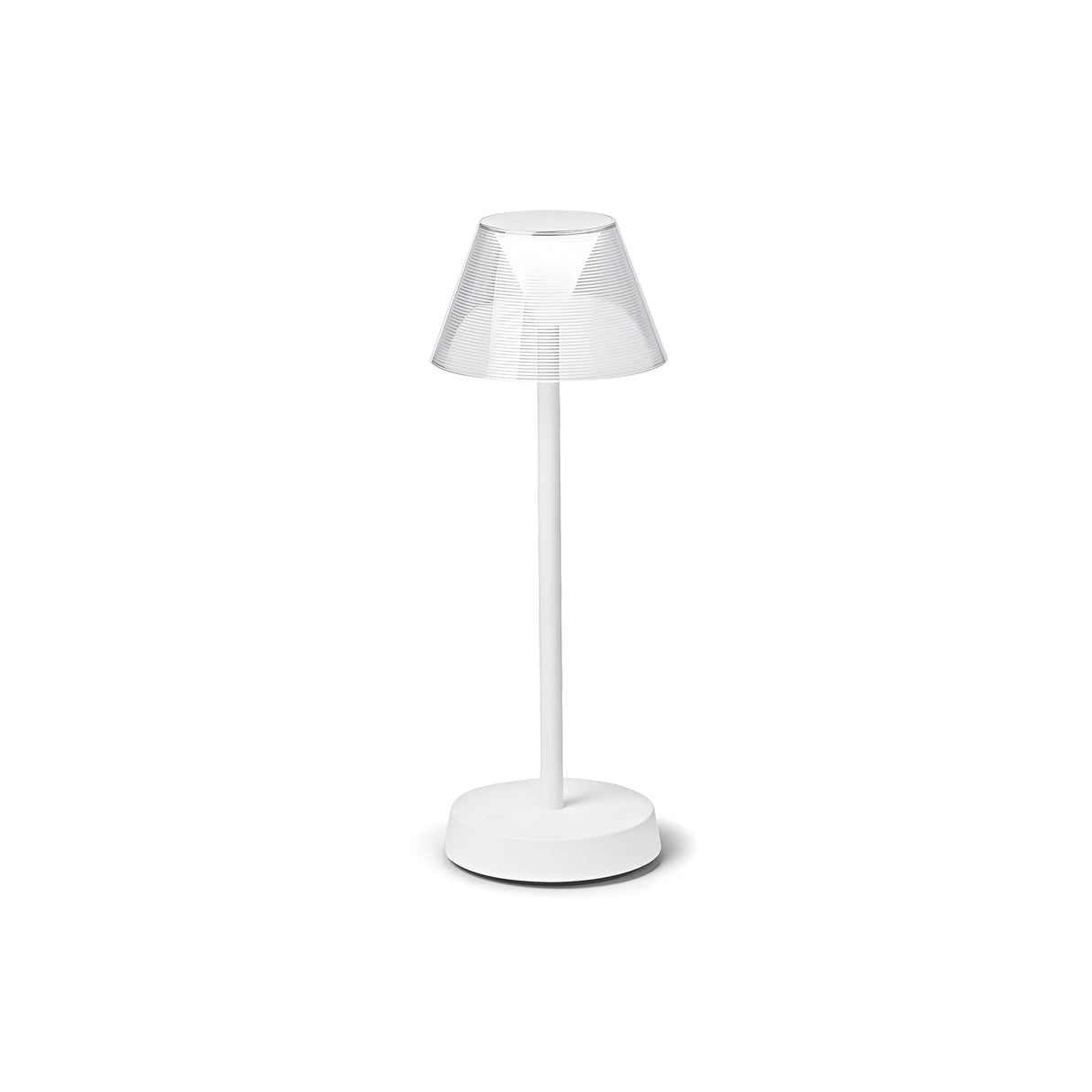 The Solitus LED Outdoor Table Lamp 2.8W 3000K - White is a contemporary outdoor lighting piece featuring a transparent, tapered lampshade atop a sleek stand with a round base. This lamp comes with a rechargeable battery and boasts an IP54 rating for enhanced durability, all showcased against a plain white backdrop.