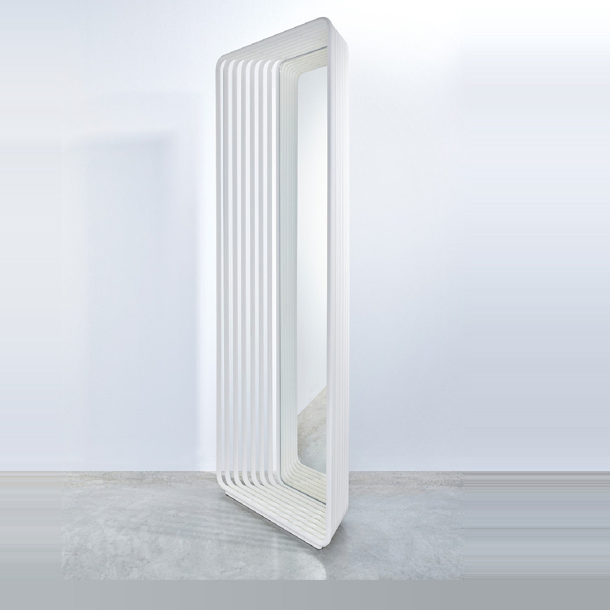 Echo White free standing cheval mirror, 193cm tall, with a stacked white powder-coated metal slat frame curving at the base, shown at an angle on a plain background.