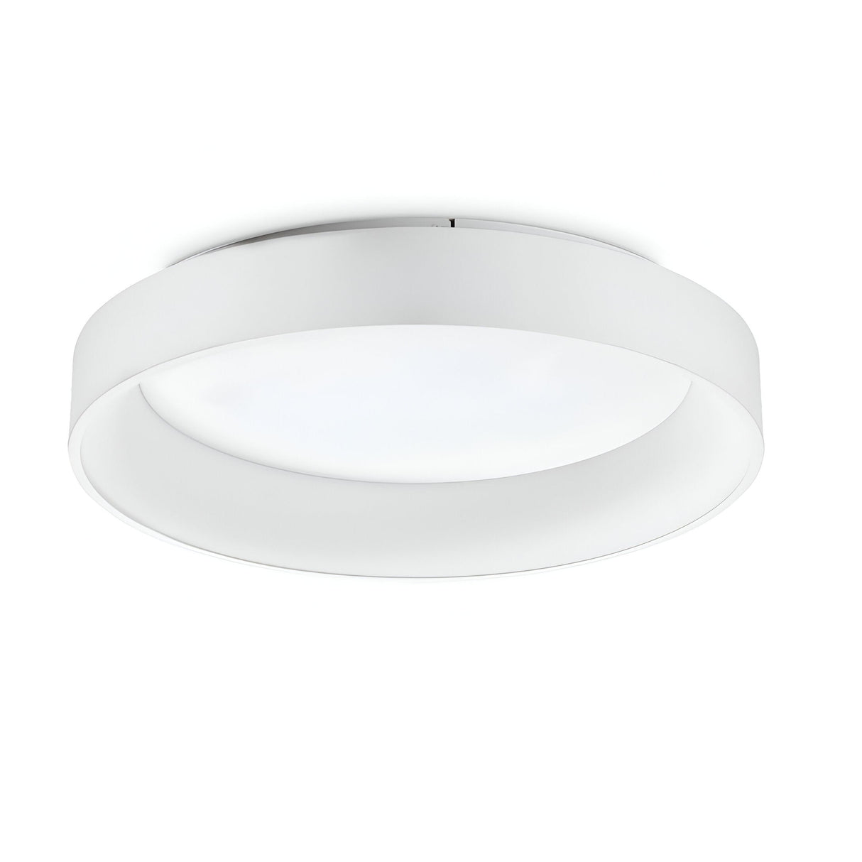 The Fluxis LED Flush Ceiling Light - White, 60cm enhances modern interiors with its sleek, minimalist design. This circular fixture features a white rim and an opaque diffuser that provides energy-efficient illumination. When mounted on a white ceiling, it seamlessly blends into the space.