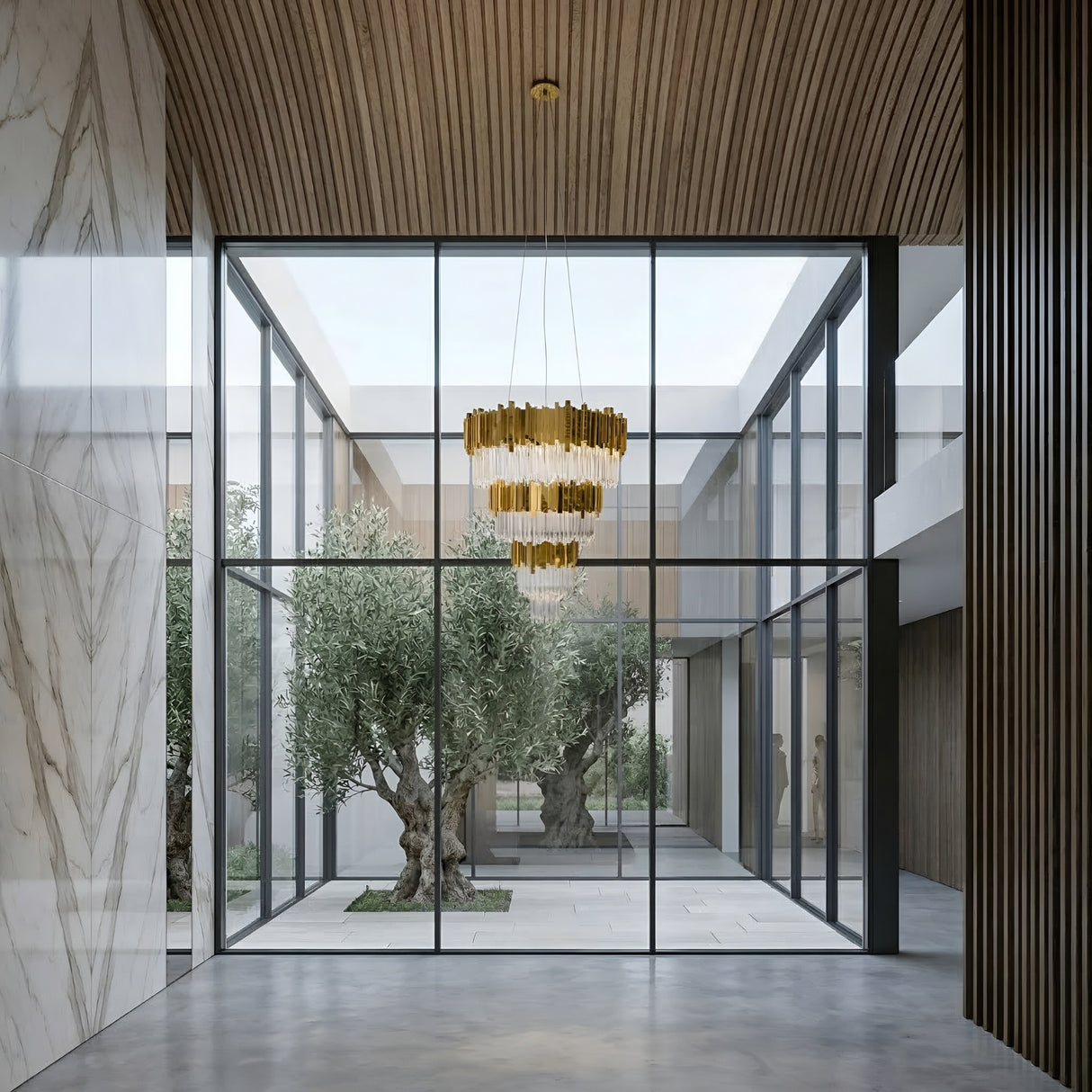 Niori Royal 30-Light Tiered Crystal Chandelier in gold hanging from a wood-slat ceiling above a glass-walled courtyard with olive trees and marble walls.