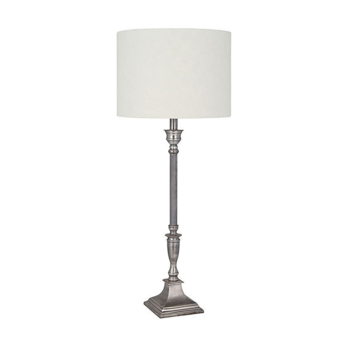 Canterbury table lamp with a candlestick-style antique silver aluminium base, square stepped foot, and white drum shade, shown on a plain white background.