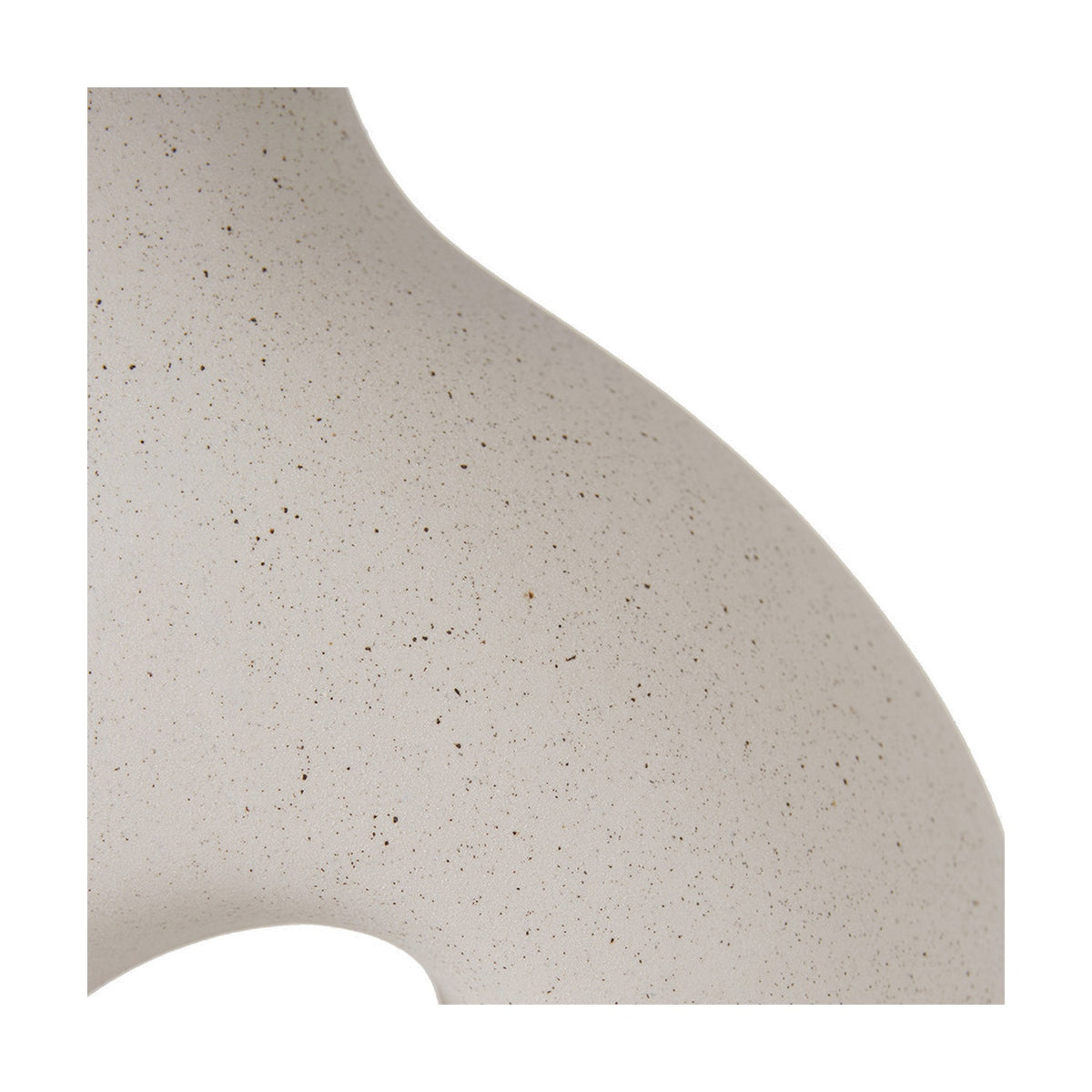 Close-up of the Ulla Monochrome Cream Organic Ceramic Table Lamp base showing its curved, speckled cream ceramic surface and organic wave-like silhouette against a white background.