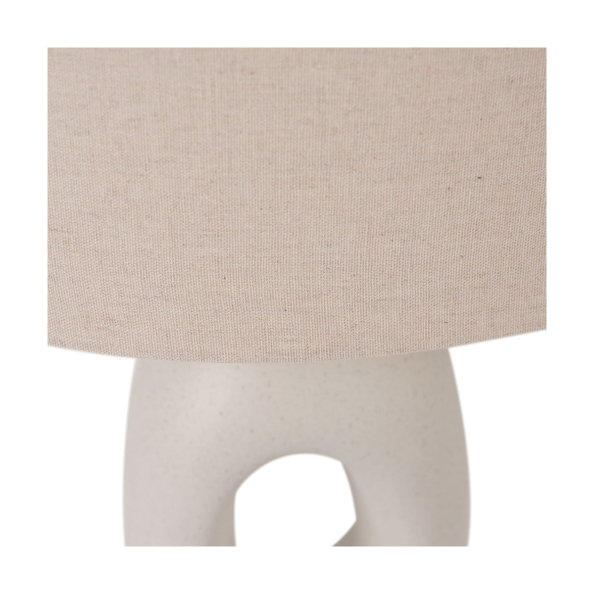 Close-up of the Laila Natural Beige Organic Tall Ceramic Table Lamp, showing the linen drum shade and sculptural white ceramic base with an open cut-out detail.