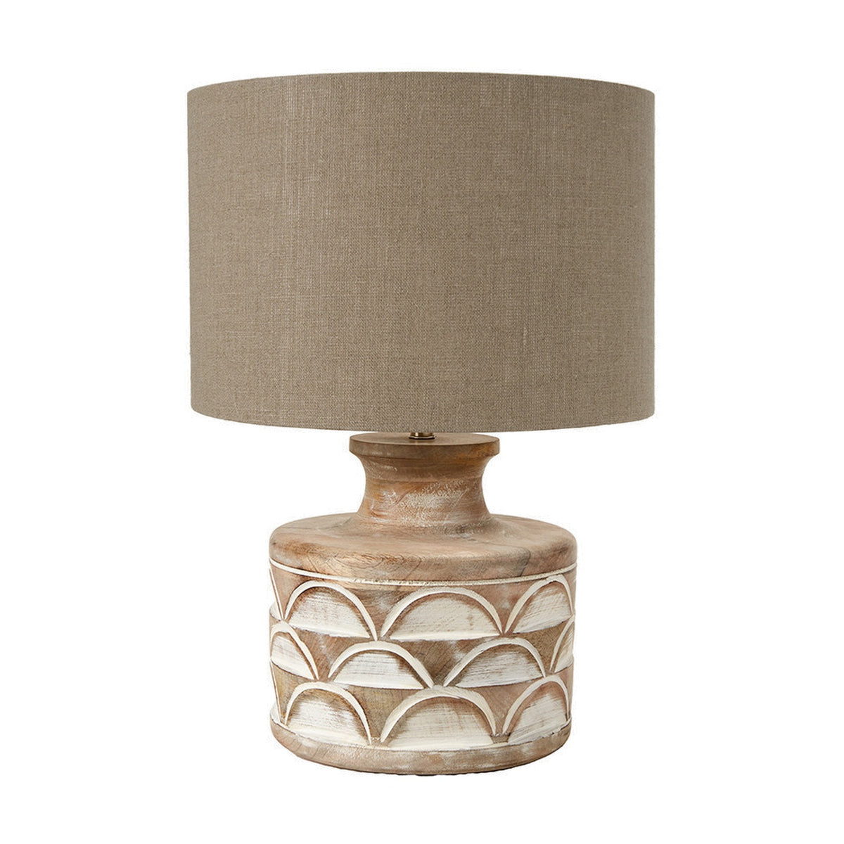 Kingsbury table lamp with a carved white wash wood base featuring scalloped detailing and a taupe drum shade, shown on a plain white background.