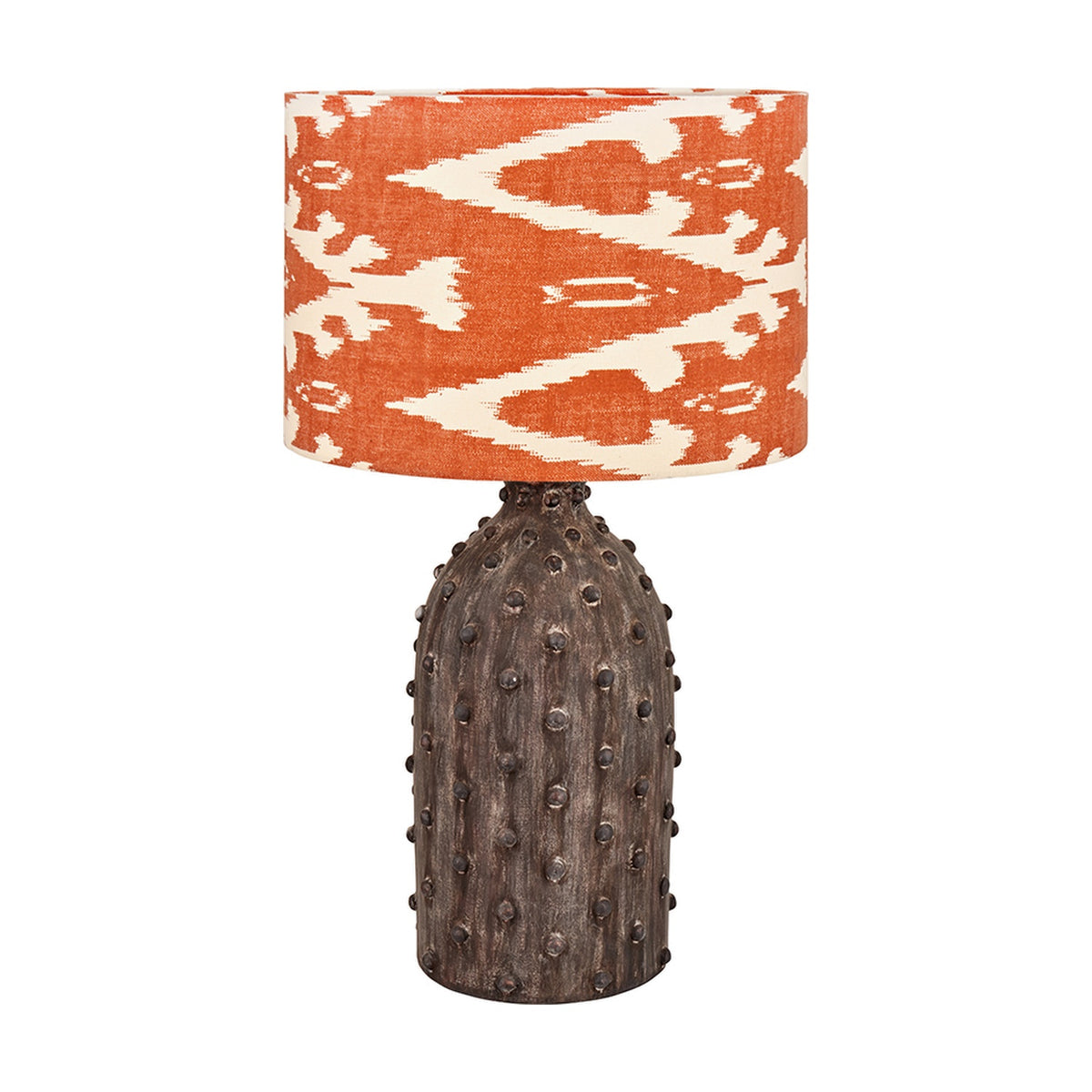 Kali Textured Dot Grey Stoneware Table Lamp Base, 37cm, with an orange and cream ikat-print drum shade, shown on a plain white background.
