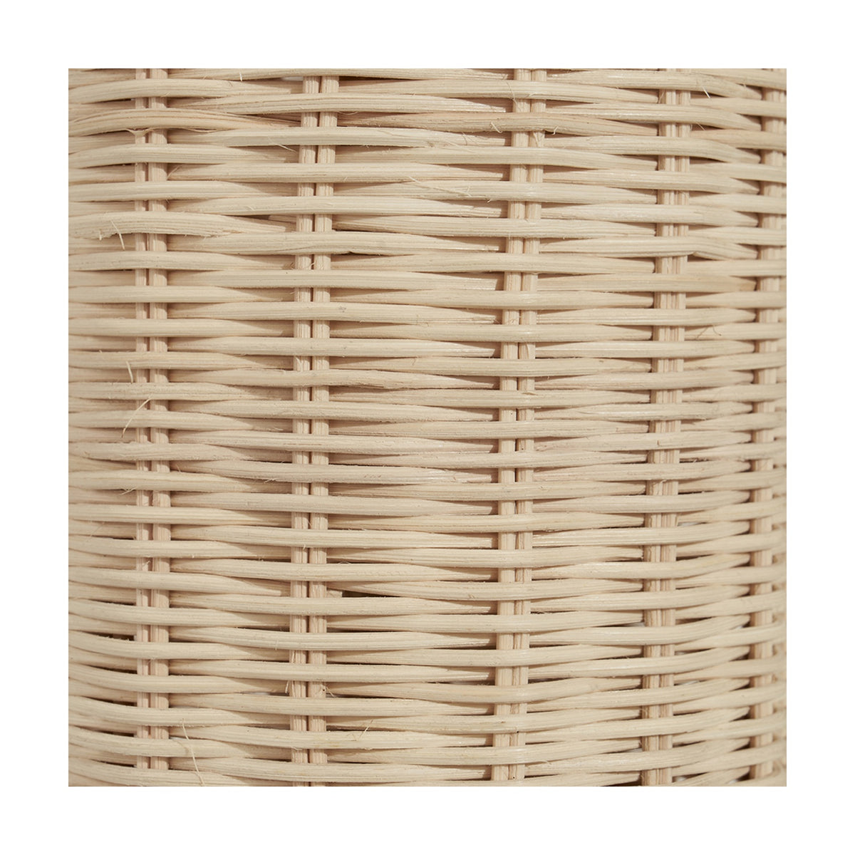 Close-up of the natural rattan basket weave on the Anika Rattan Bottle Table Lamp base, showing the tightly woven cane pattern.