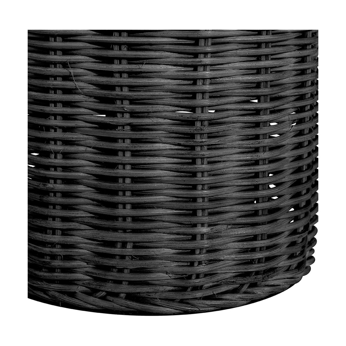 Close-up of the Anika Black Rattan Bottle Table Lamp base, showing tightly woven black rattan texture with a curved cylindrical shape.