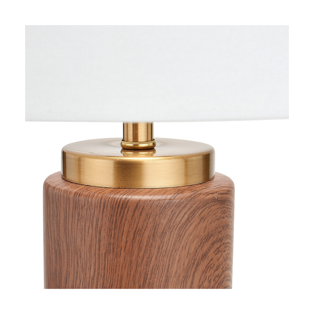 Close-up of the Carrara Wood Effect Ceramic Tall Table Lamp, showing the wood-effect ceramic base with brushed brass collar beneath a white fabric shade.