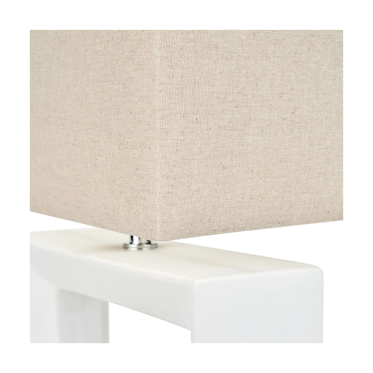Close-up of the Block White Ceramic Rectangular Table Lamp, showing the rectangular linen shade resting on a white glazed ceramic base with a chrome fitting.