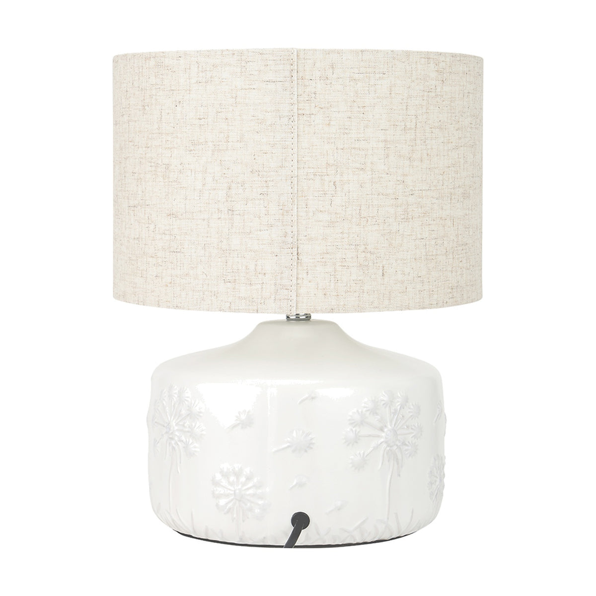 Flora White Small Floral Ceramic Table Lamp with a raised dandelion motif base and drum-shaped linen shade, shown on a plain white background.