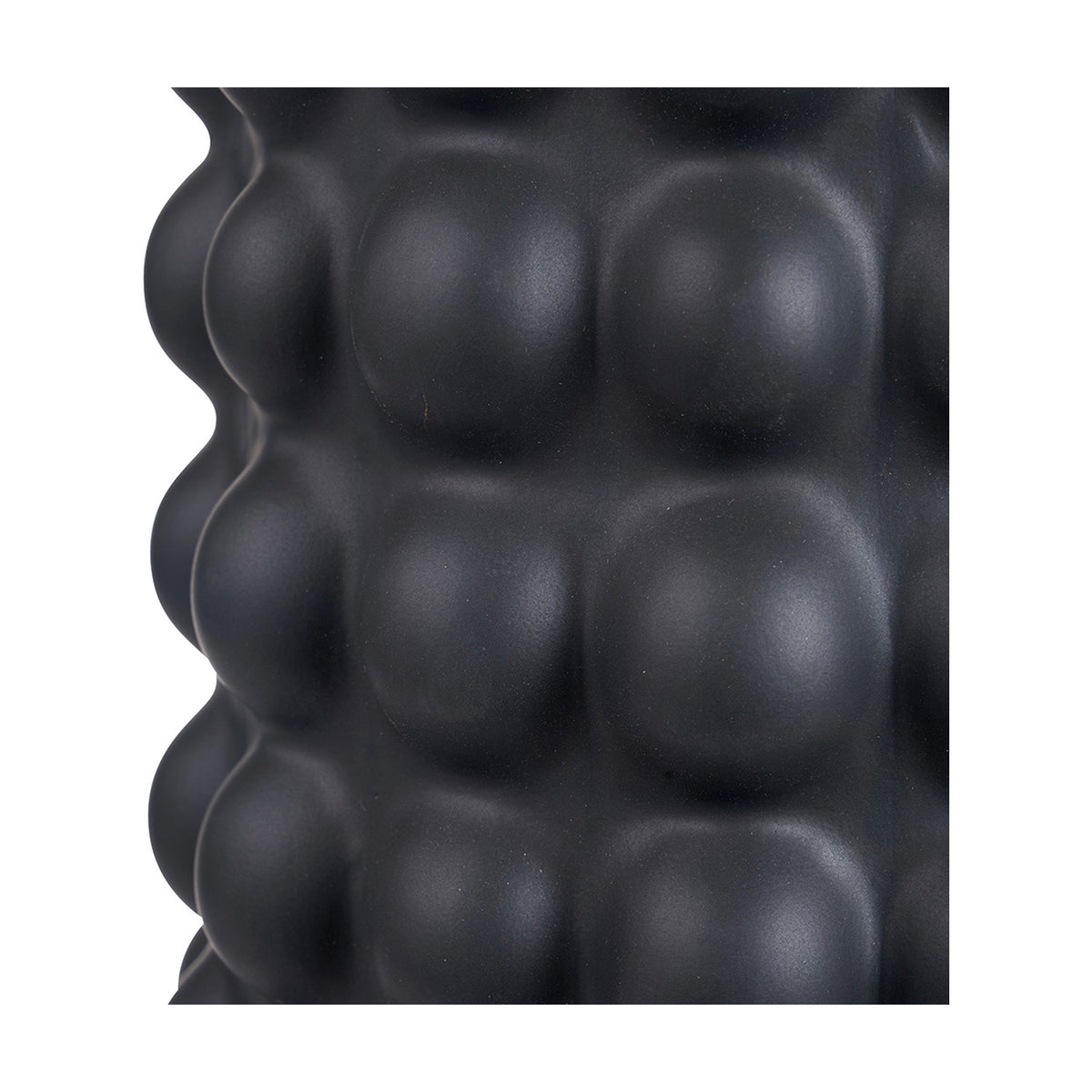 Close-up of the Sohan Black Bobbled Ceramic Tall Table Lamp Base, 48cm, showing its textured, rounded bobbled surface in a matte black finish.