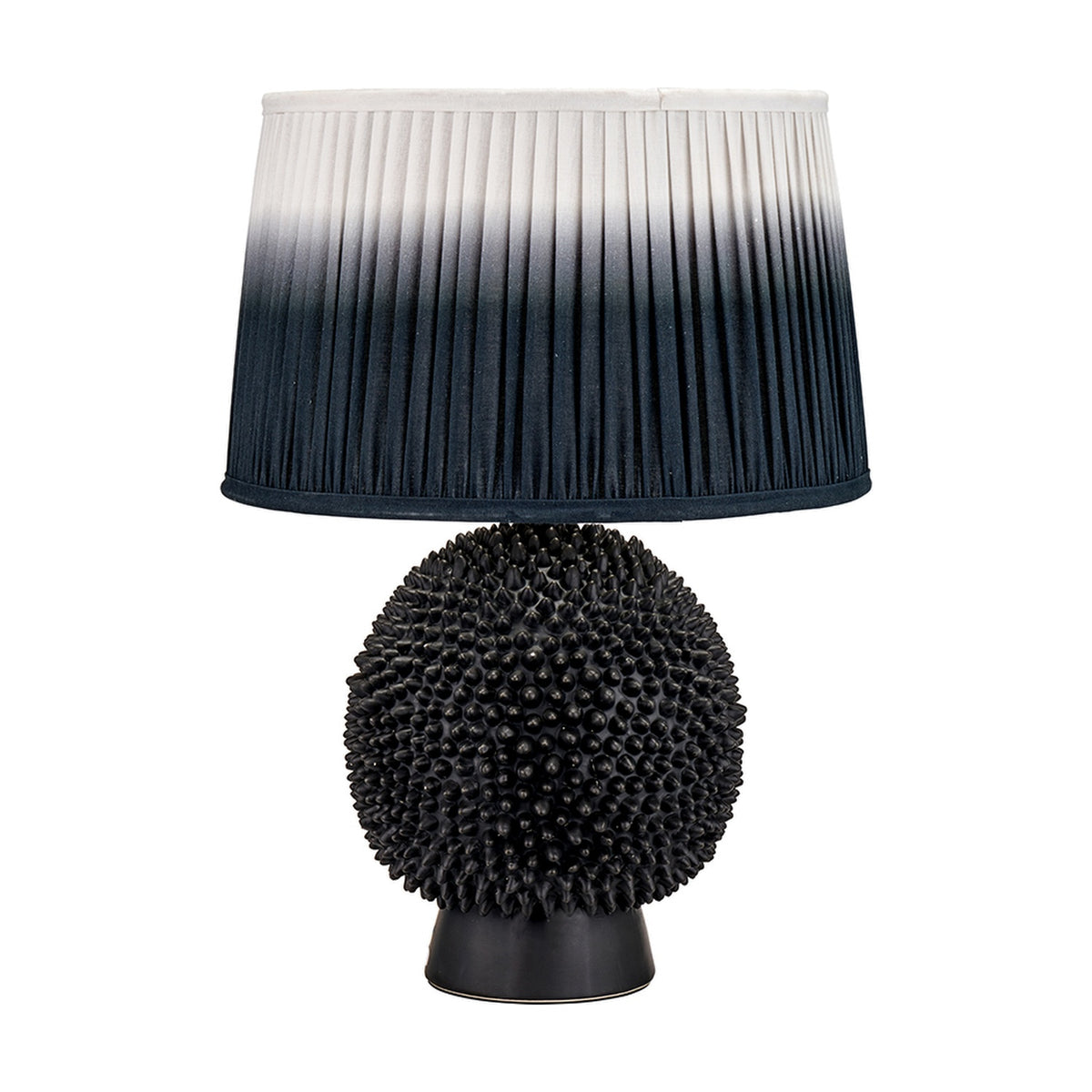 Wrenley Black Ceramic Sea Urchin Table Lamp Base, 37cm, with spiky textured sphere design and pleated ombre grey-to-white shade, on a plain white background.
