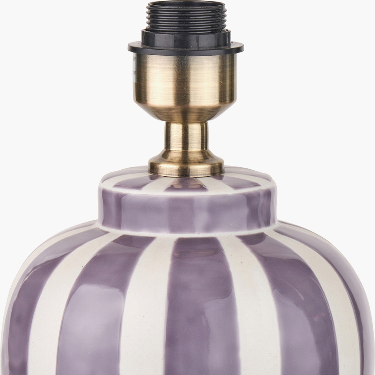 Close-up of the Priscilla Lilac Stripped Ceramic Table Lamp Base showing the antique brass E27 bulb holder atop a purple and white striped ceramic body, on a plain background.