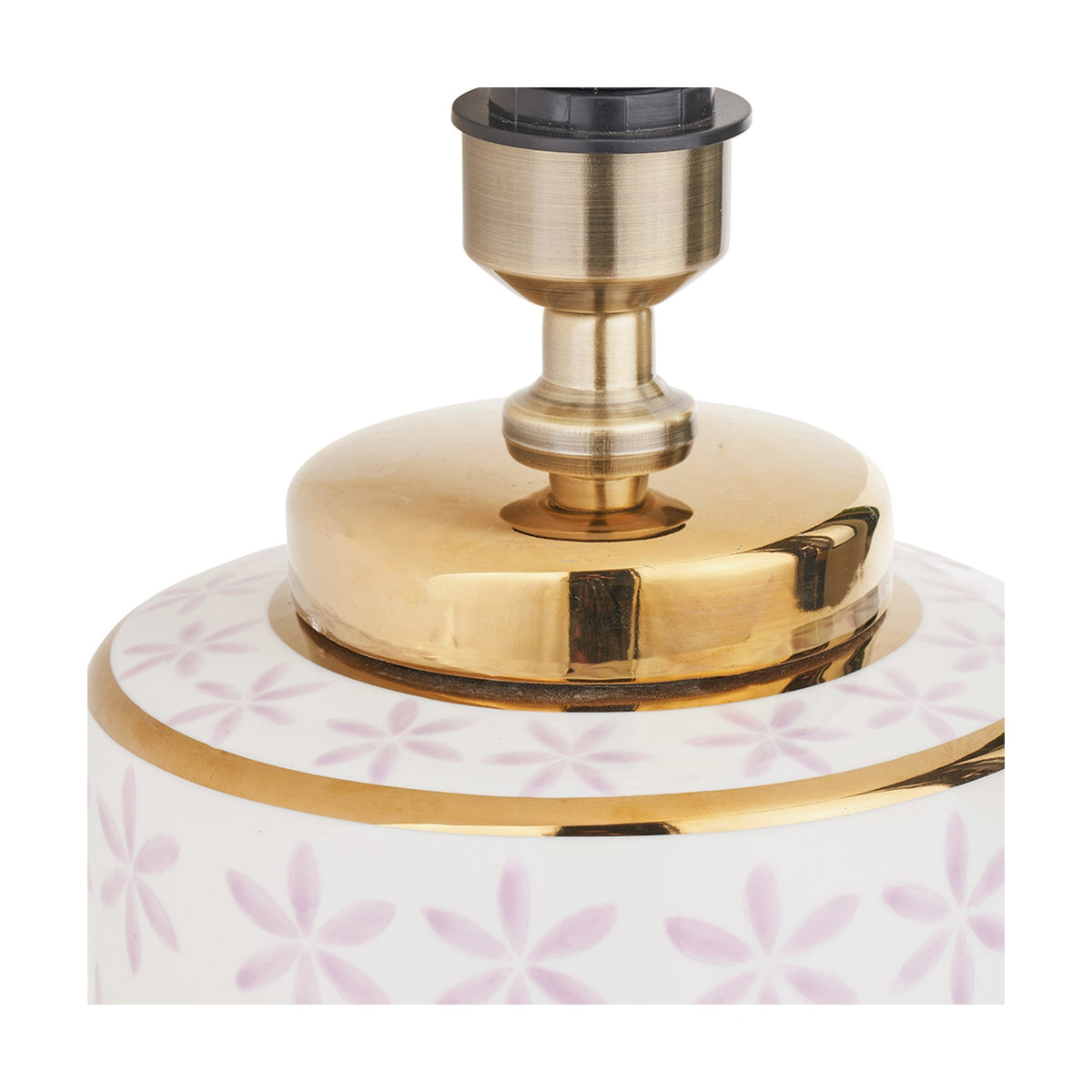 Close-up of the Thea ceramic table lamp base's gold neck fitting with brass lamp holder, sitting above a white body patterned with lilac floral motifs and a gold rim band.