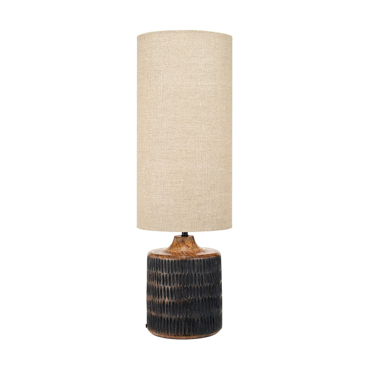 Alaric table lamp, 77cm, with a textured antique black mango wood base and tall cylindrical natural linen shade, shown against a plain white background.
