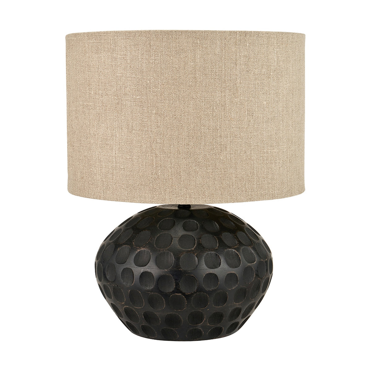 Dante Antique Black Mango Table Lamp, 42cm, with a rounded carved wood base in a dimpled dot pattern and a natural linen drum shade, shown on a plain white background.