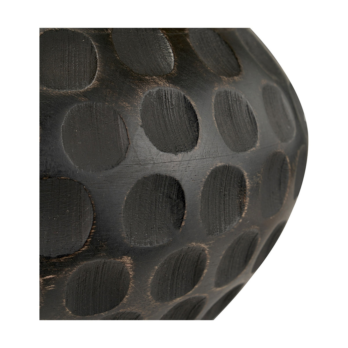 Close-up of the Dante Antique Black Mango Table Lamp base, showing a carved wood surface with rounded scalloped indentations in a matte black antique finish.