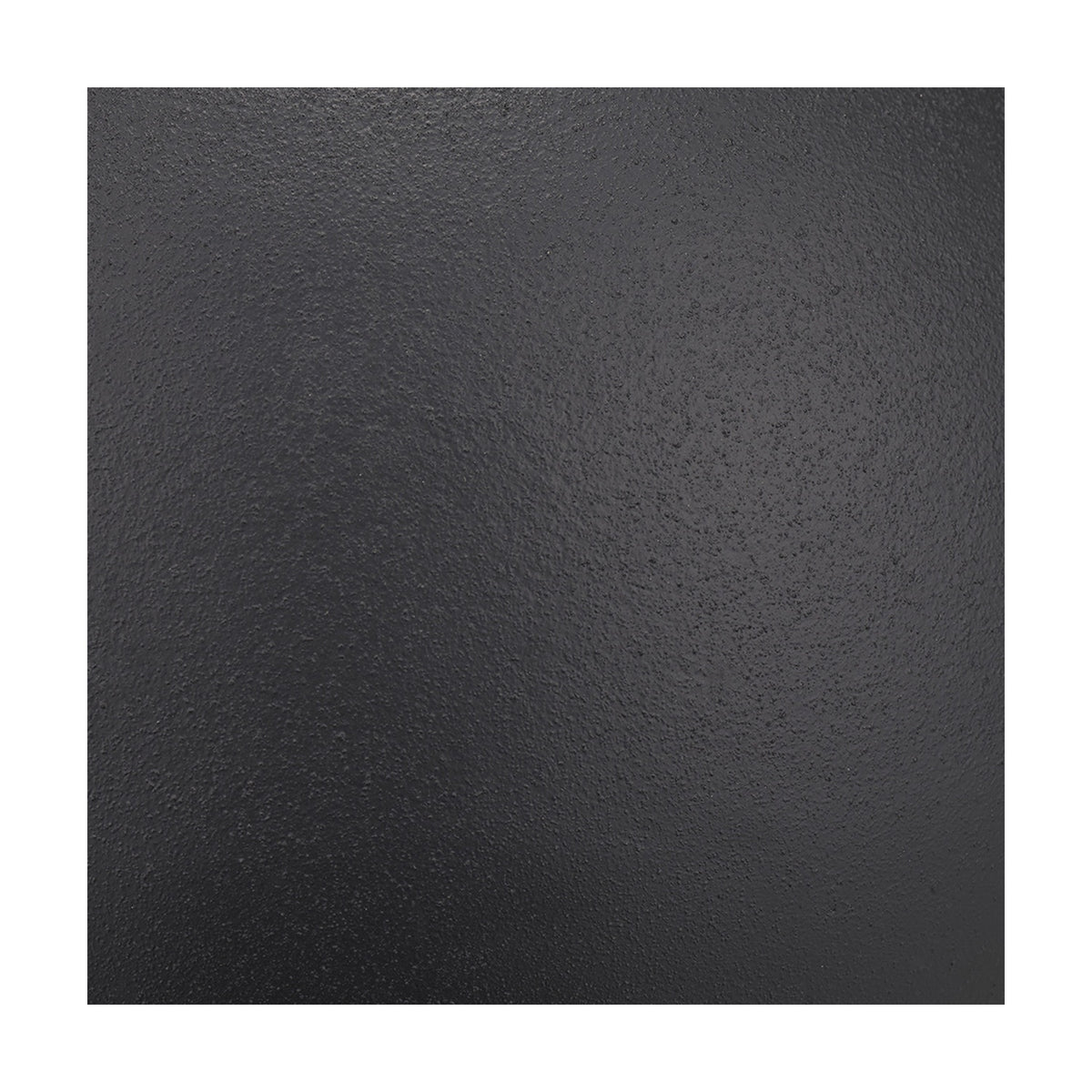 Close-up of the Benio table lamp base in matt black aluminium, showing its textured spherical surface finish.