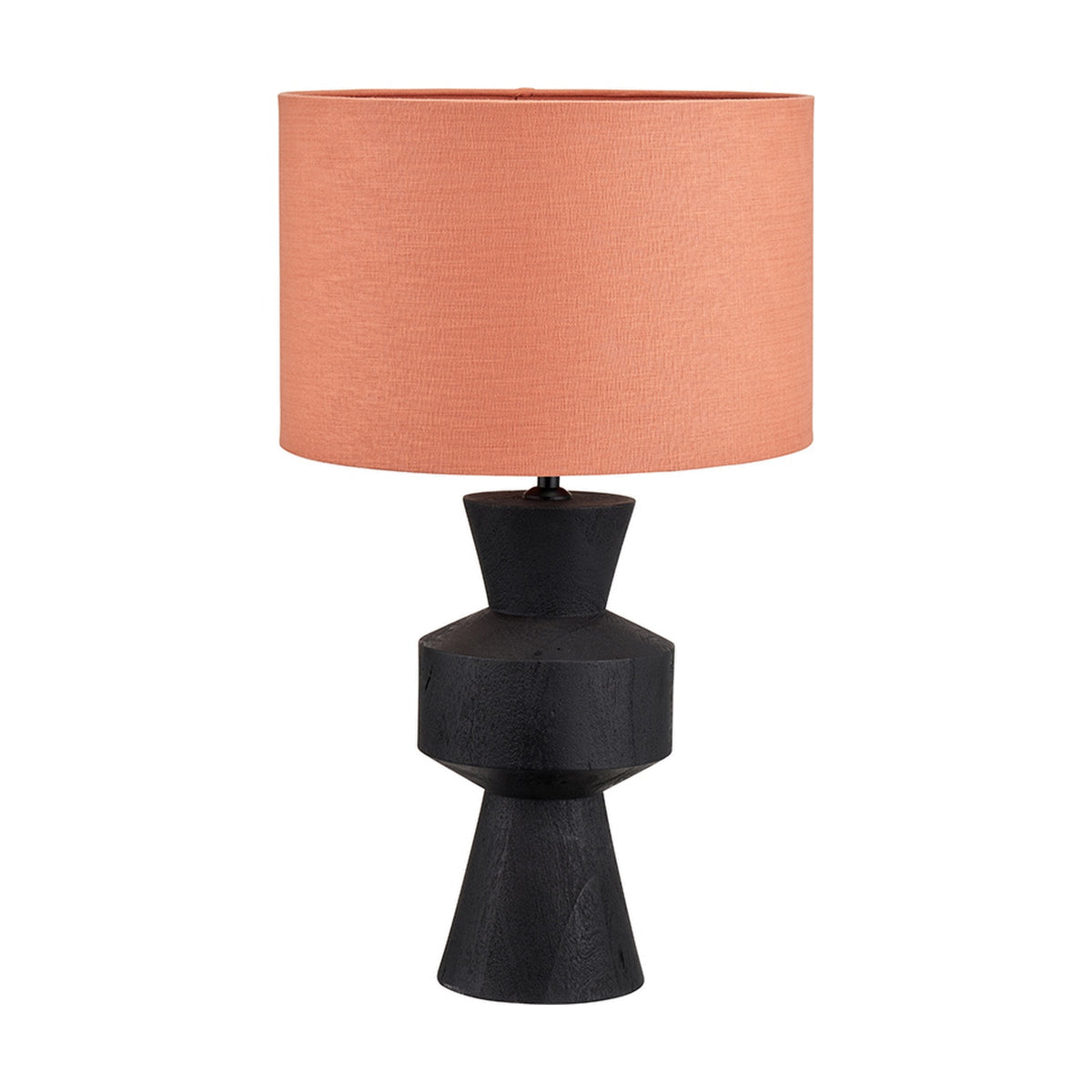Koa Black Mango table lamp with a sculpted geometric wood base and coral drum shade, shown on a plain white background.
