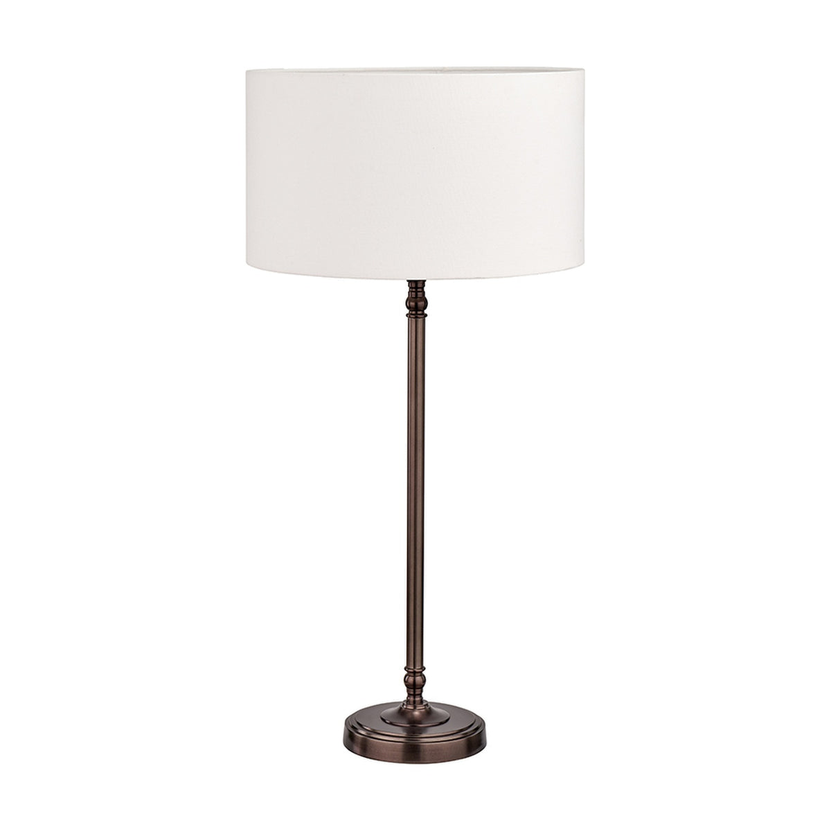 Piero Antique Bronze Candlestick Table Lamp with white drum shade, slender fluted metal stem, and round stepped base, shown on a plain white background.