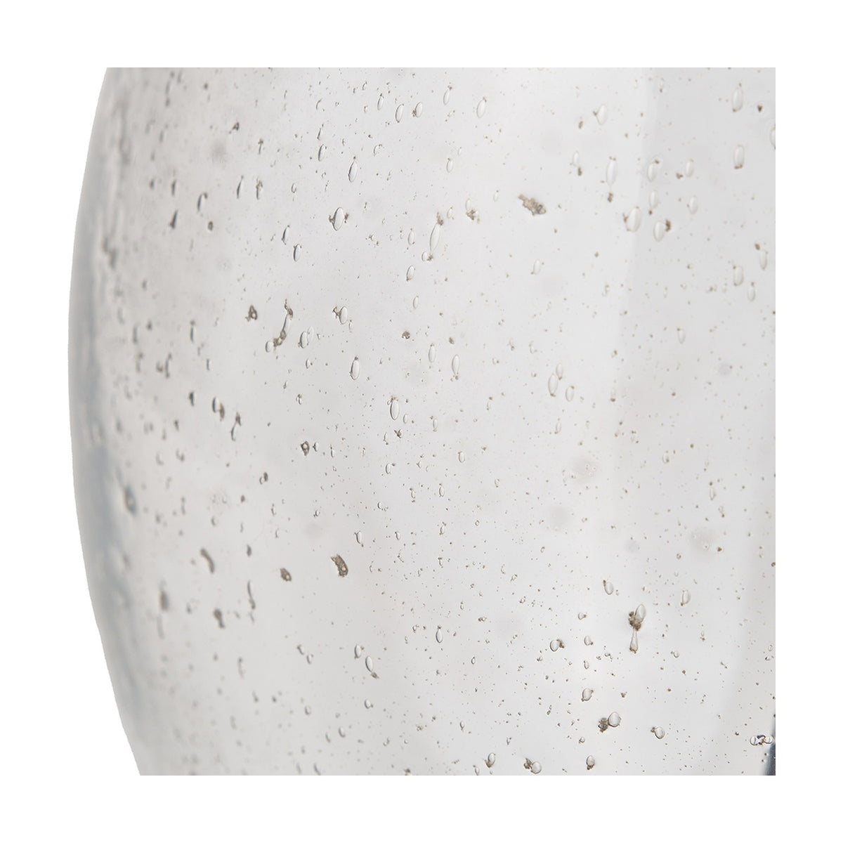 Close-up of the Elysia table lamp base showing bubble-textured glass with visible air bubbles and specks, in a translucent white-grey tone against a plain background.